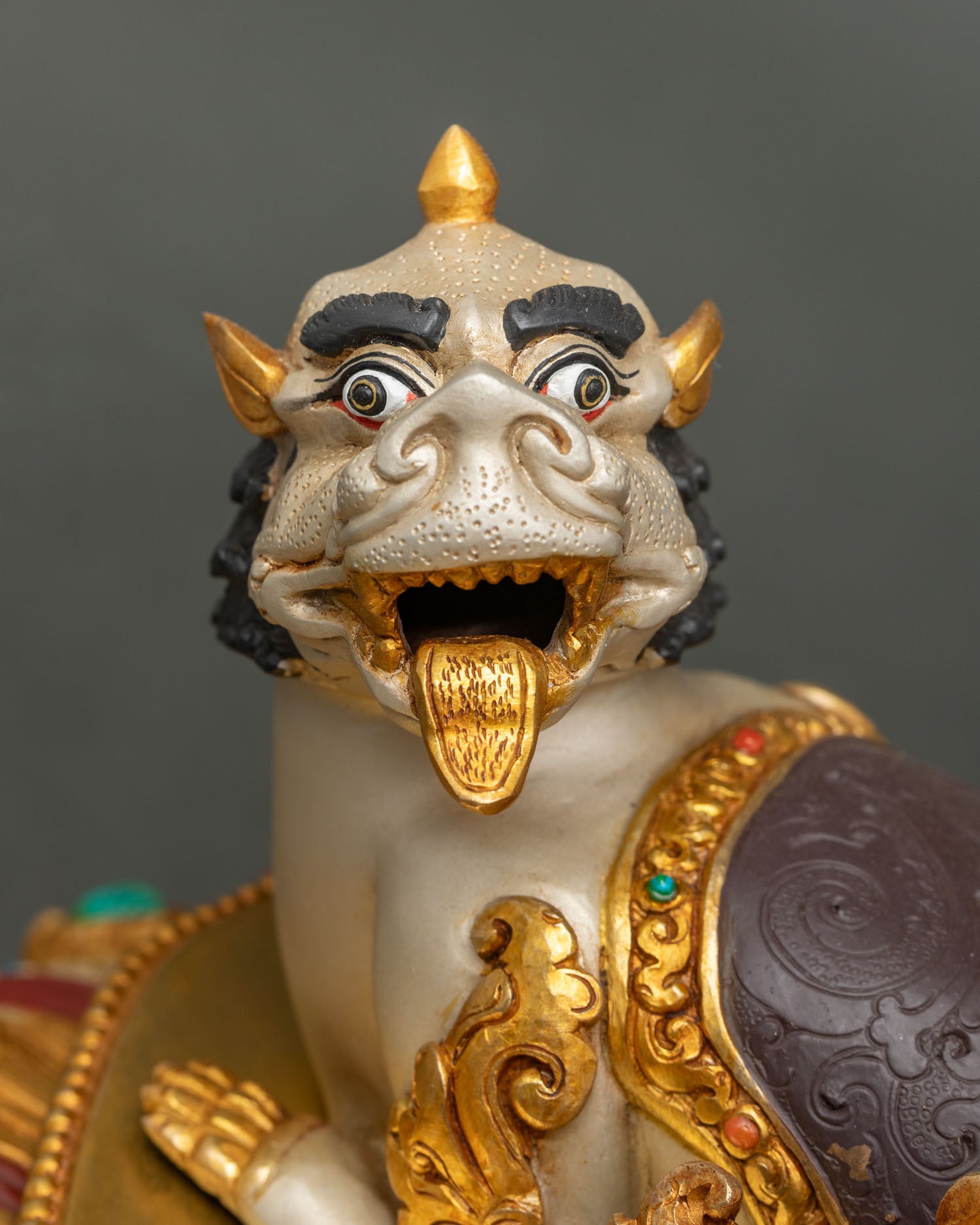 Snow lion close-up silver-plated acrylic finish gold tongue Dzambhala companion statue