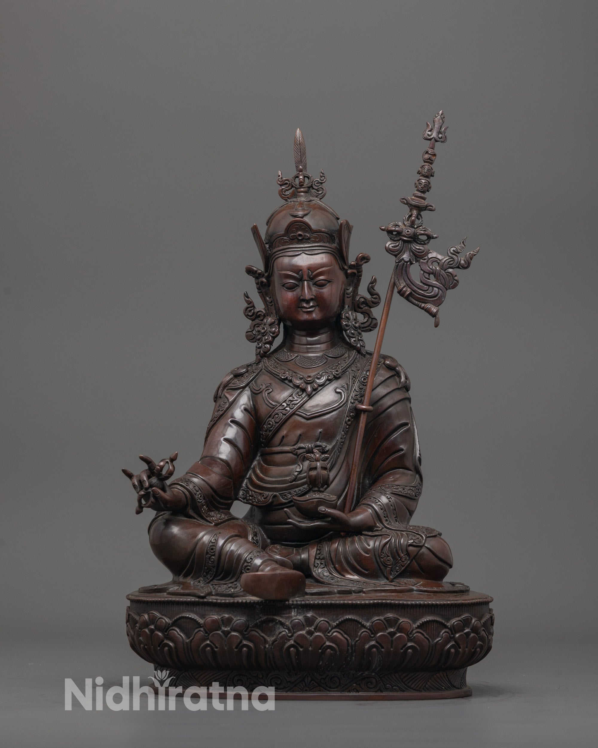 spiritual padmasambhava statue front view with oxidized copper and lotus base craftsmanship