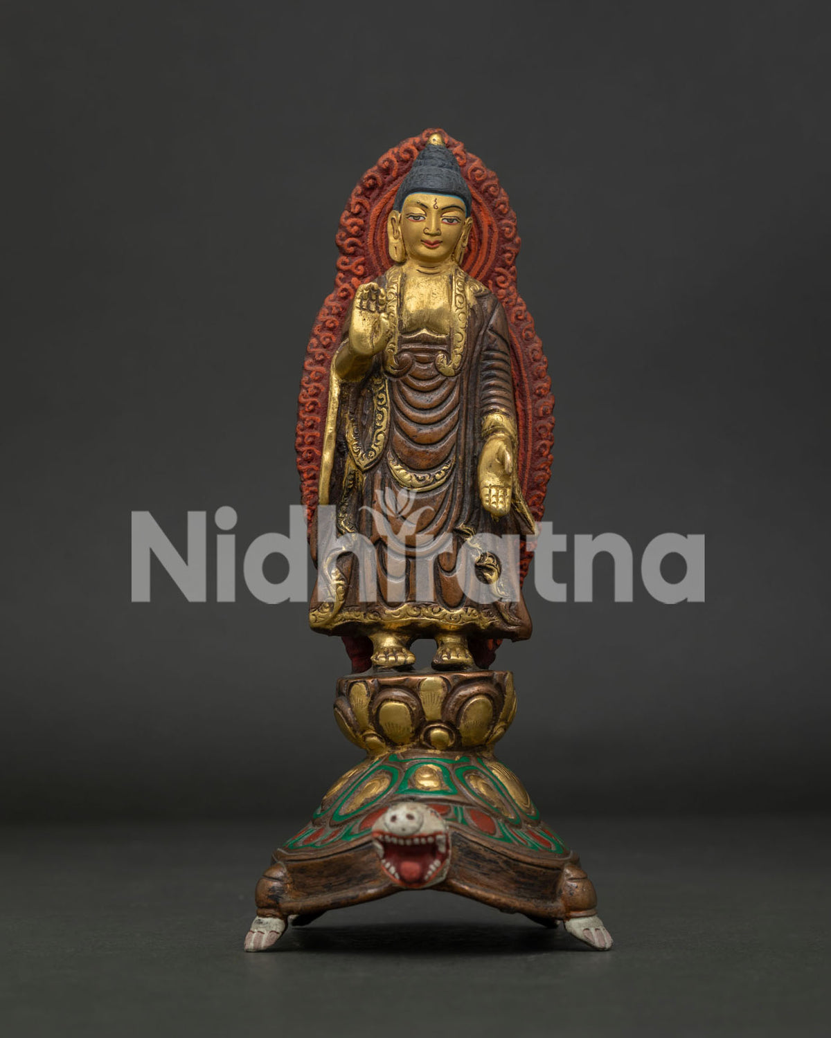 Standing Buddha statue front view oxidized gold gilded copper Nepalese sculpture.