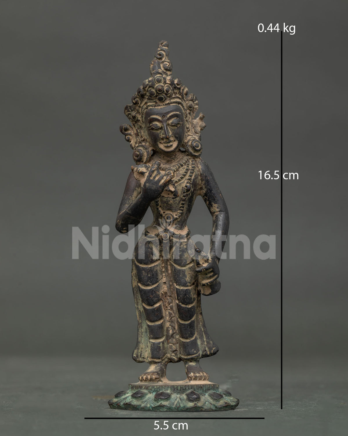 Standing Vajrasattva statue on lotus pedestal made from copper in patan nepal.