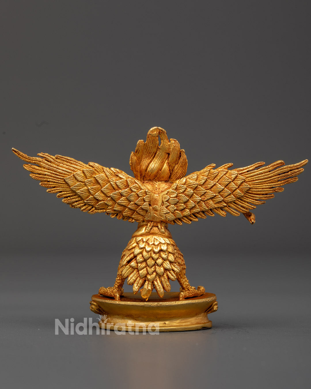 the Buddhist Garuda figurine showcasing expert craftsmanship and gold gilding, a revered symbol of courage and protection