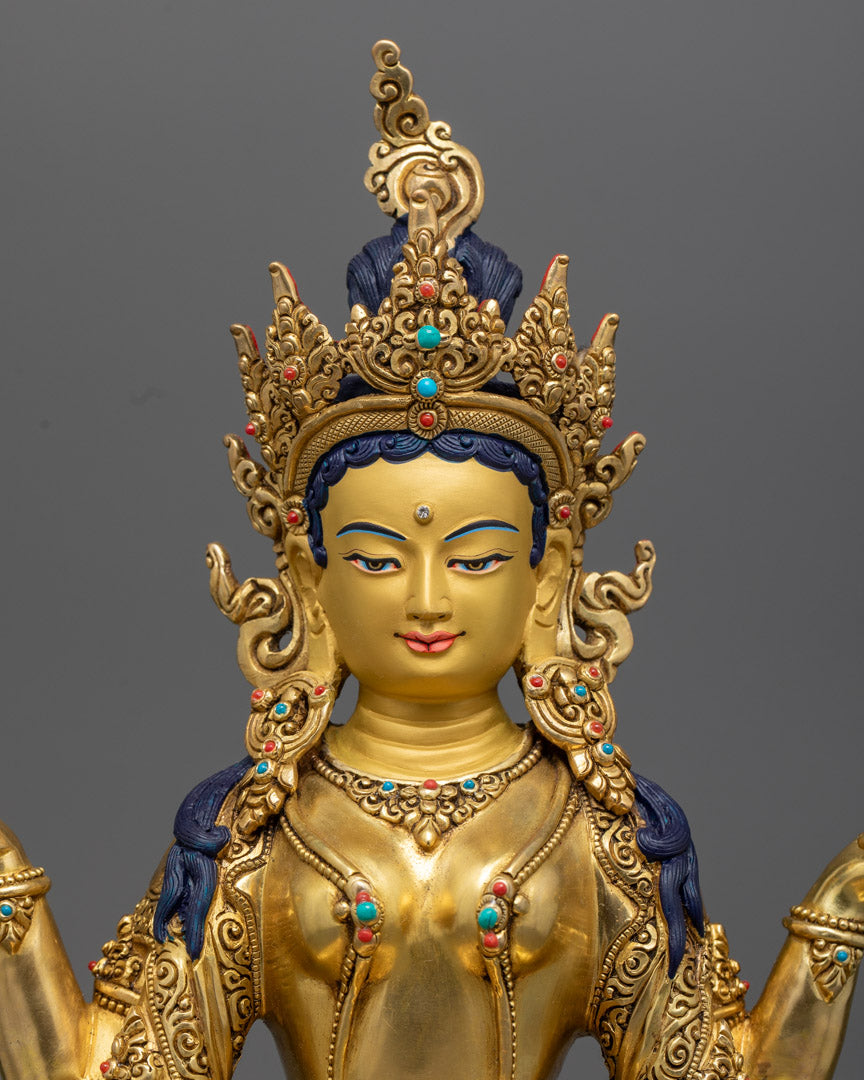the intricate detailing on a 24K gold-gilded Manjushri statue, showcasing the Bodhisattva's serene expression and dynamic posture.