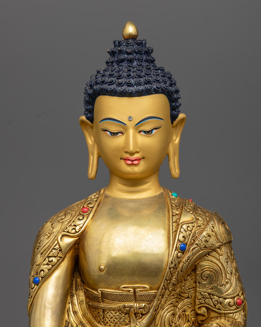 the serene Shakyamuni Buddha statue, highlighting its 24k gold gilded copper and intricate semi-precious stones.