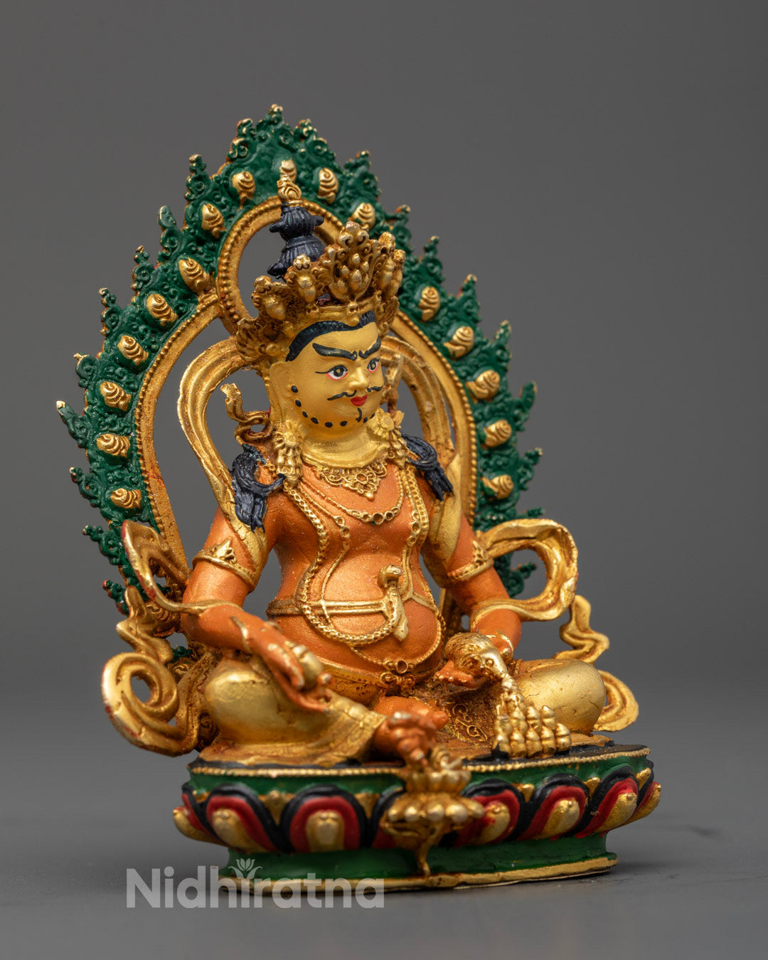 the statue’s ornate robe, luminous halo, and lotus base with conch shell beneath foot