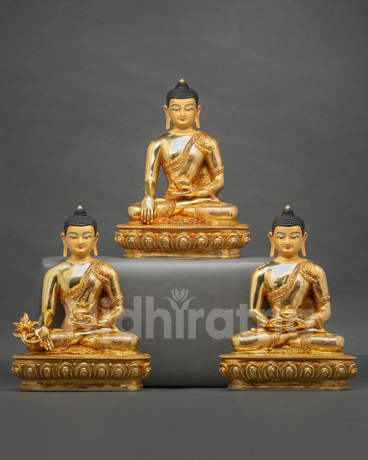 Three Buddha statue set handcrafted by Newari artisans from Patan, Nepal, showcasing copper sculptures and traditional Buddhist craftsmanship.