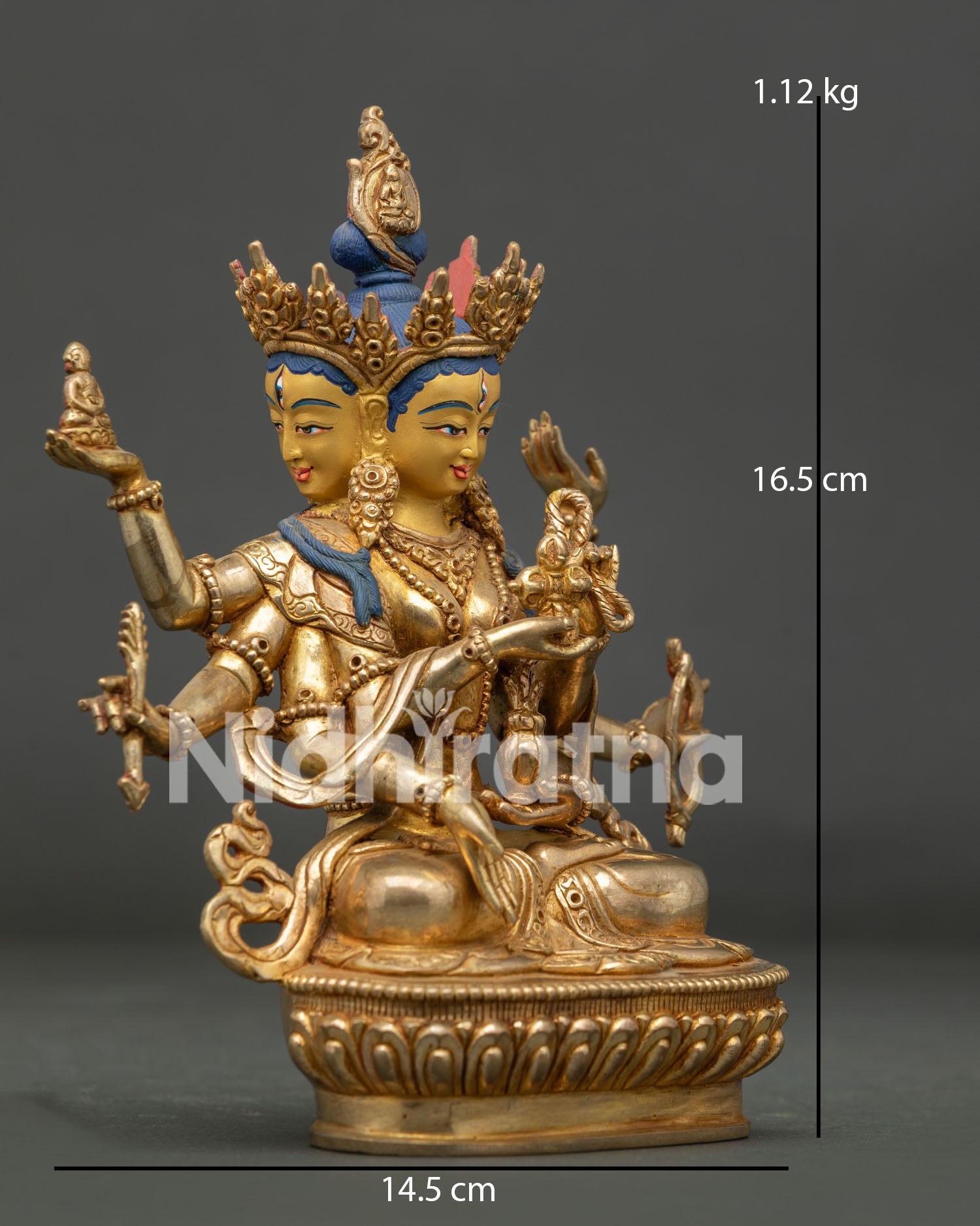 Three faced eight armed Namgyalma Buddhist deity seated on a lotus pedestal