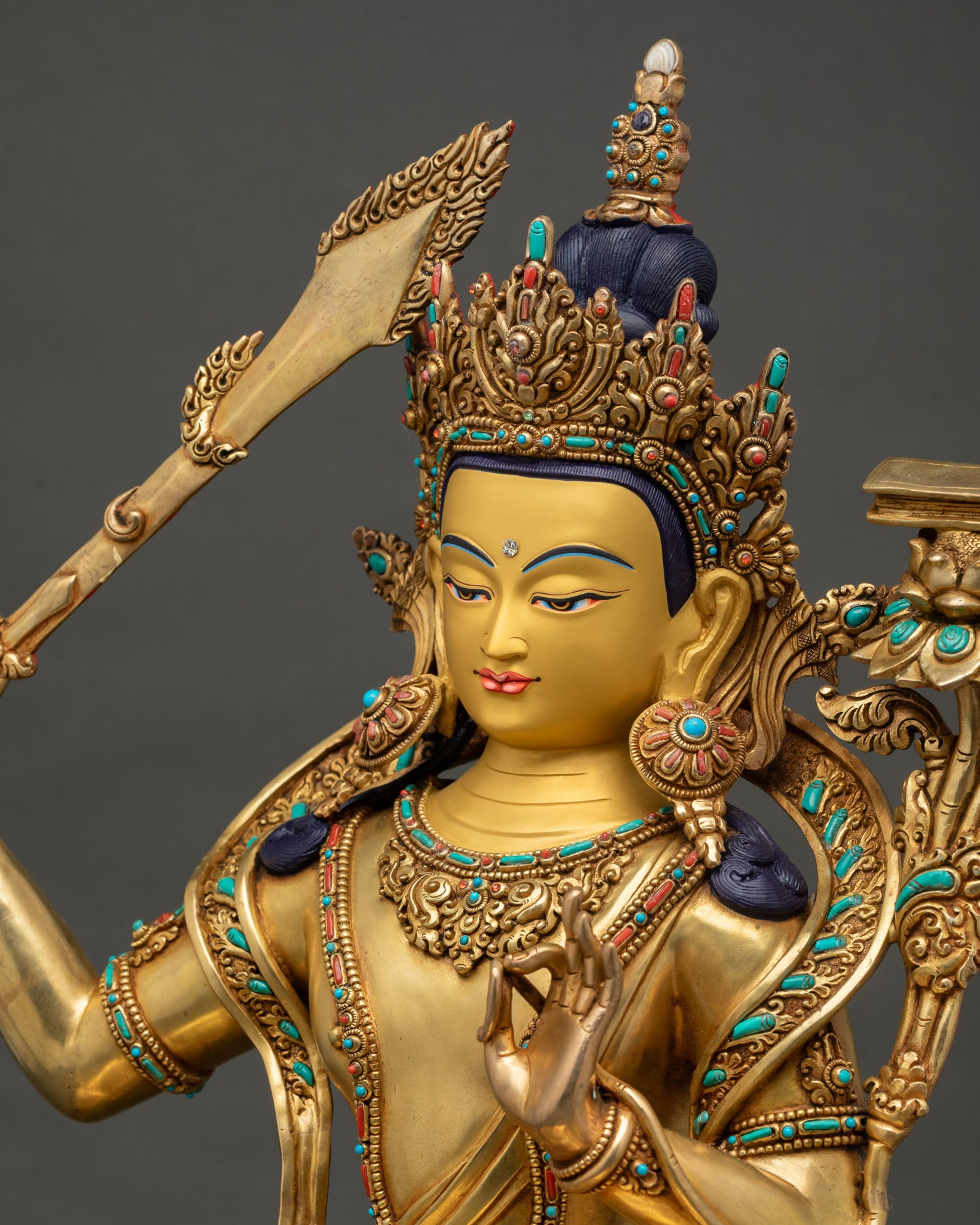 Three-quarter view of Nepalese Manjushri Statue showcasing intricate gold-gilded craftsmanship