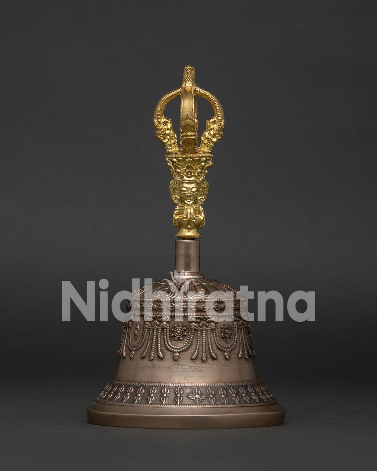 Tibetan Buddhist bell with gold plated copper handle and sacred carvings