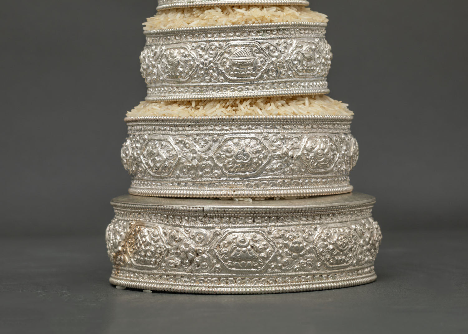 Tibetan Buddhist Mandala set with handcarved floral motifs for traditional offering practice.