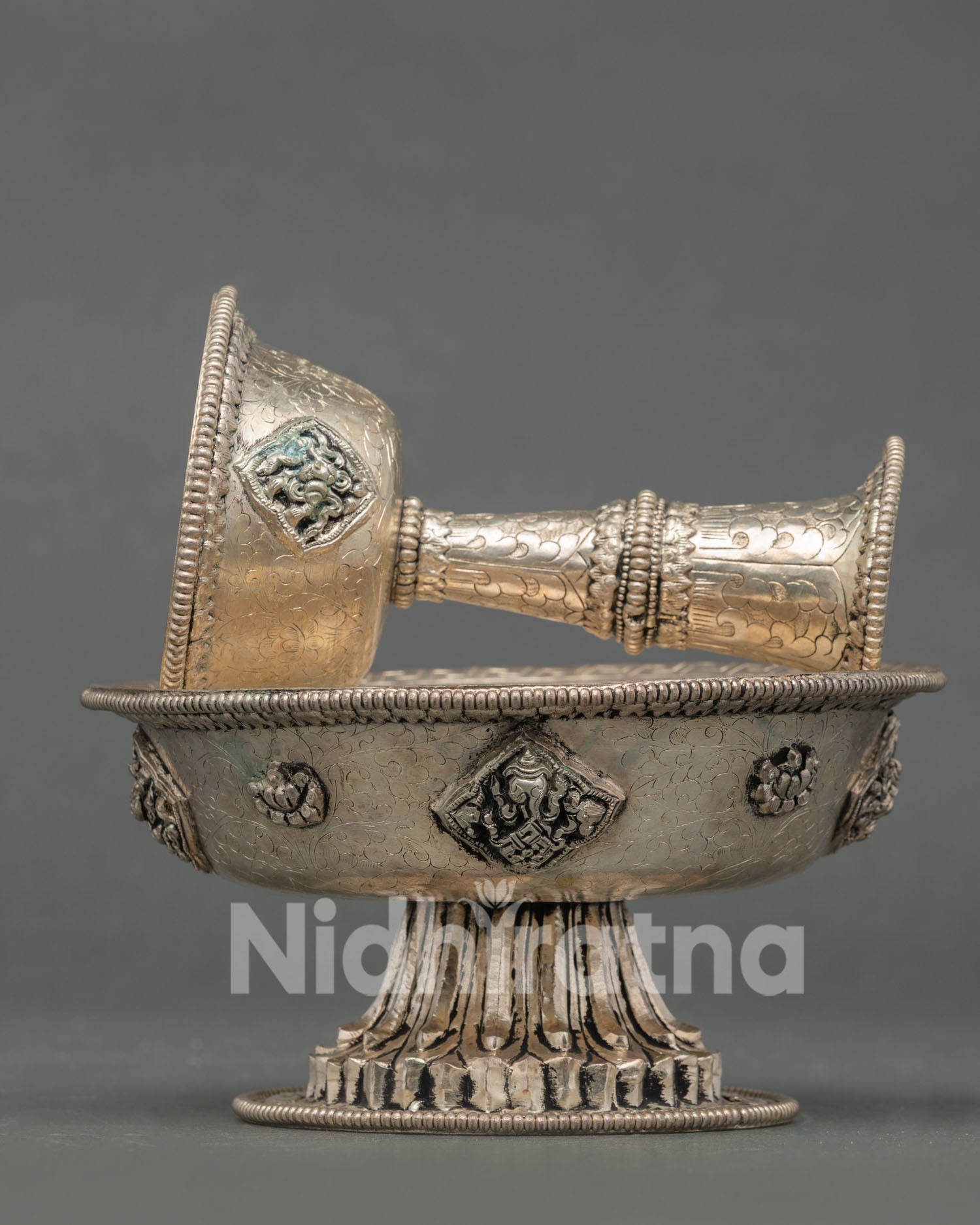Tibetan Serkyem crafted from copper with auspicious Buddhist symbol engravings
