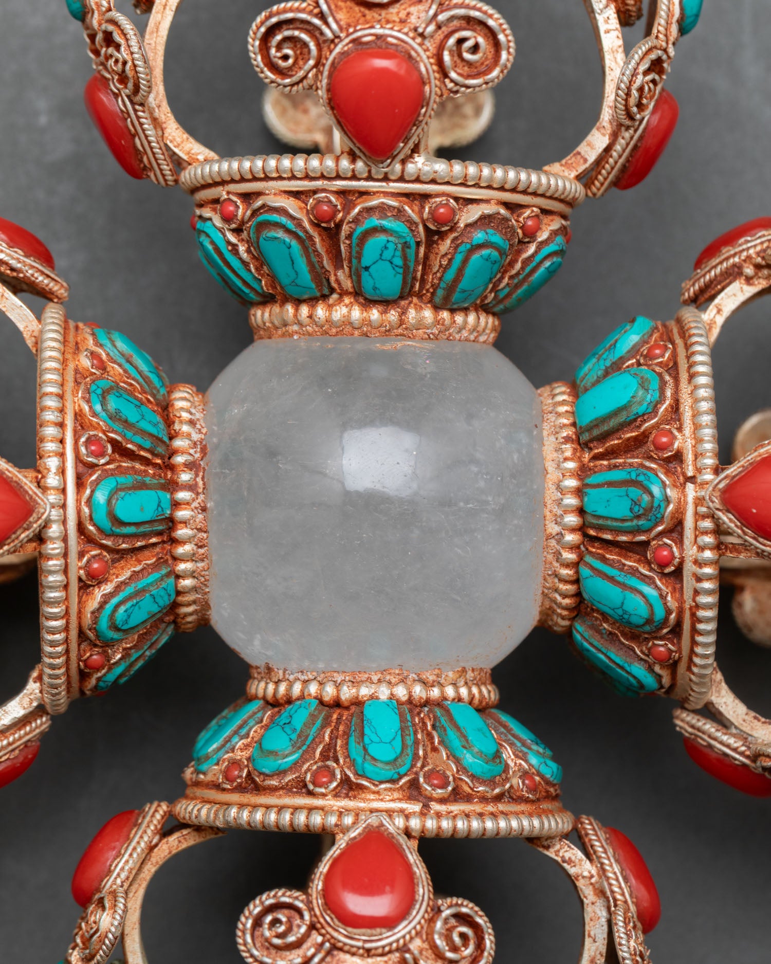 Close up Vishva Vajra copper gold filigree detailing with crystal center sphere