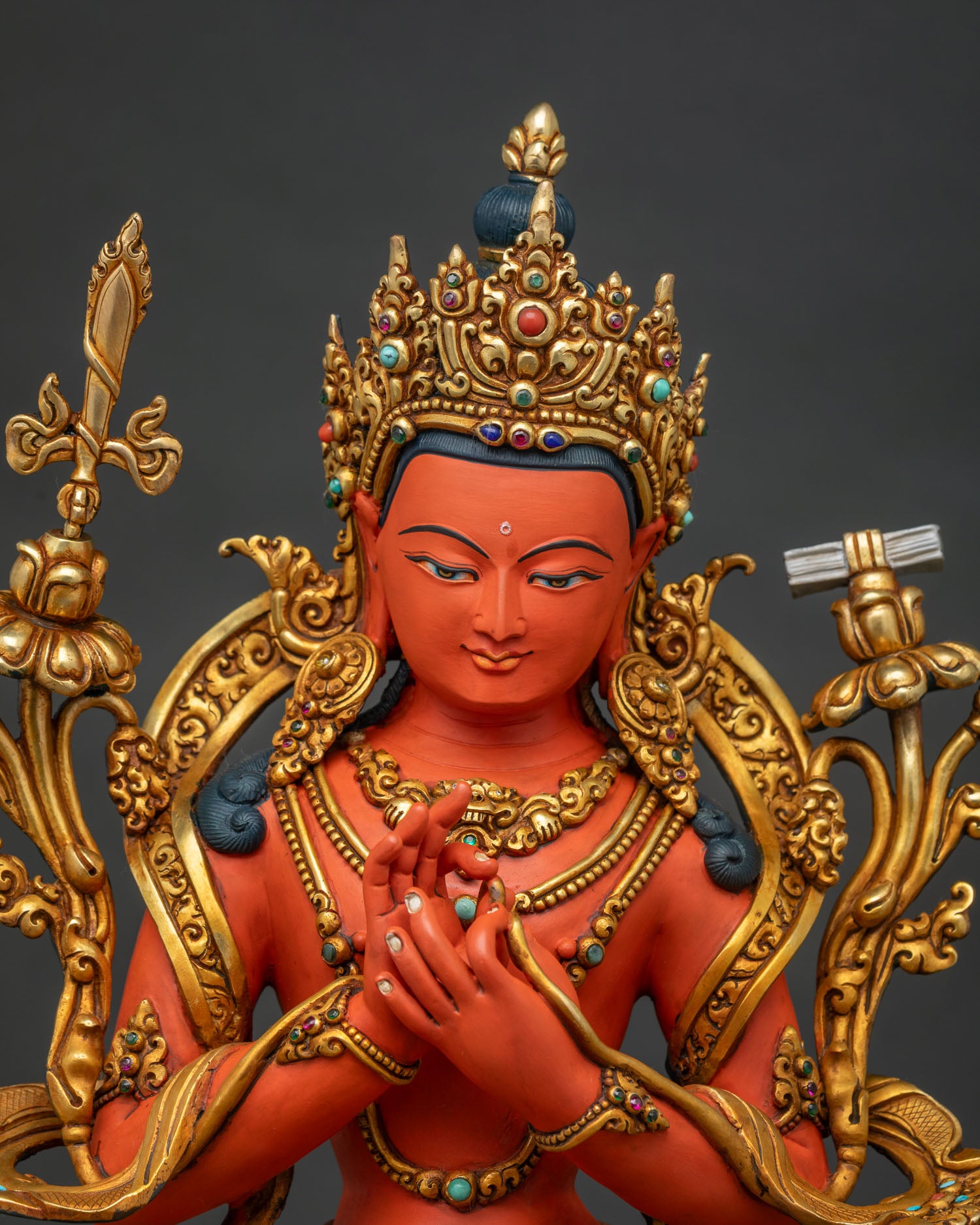 Tikshna Manjushri statue close up, dharmachakra mudra hands and gold jewelry