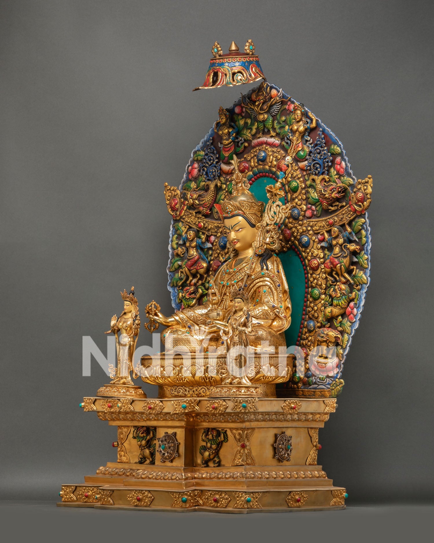 Top angle view of Guru Rinpoche statue showing crown and jeweled parasol