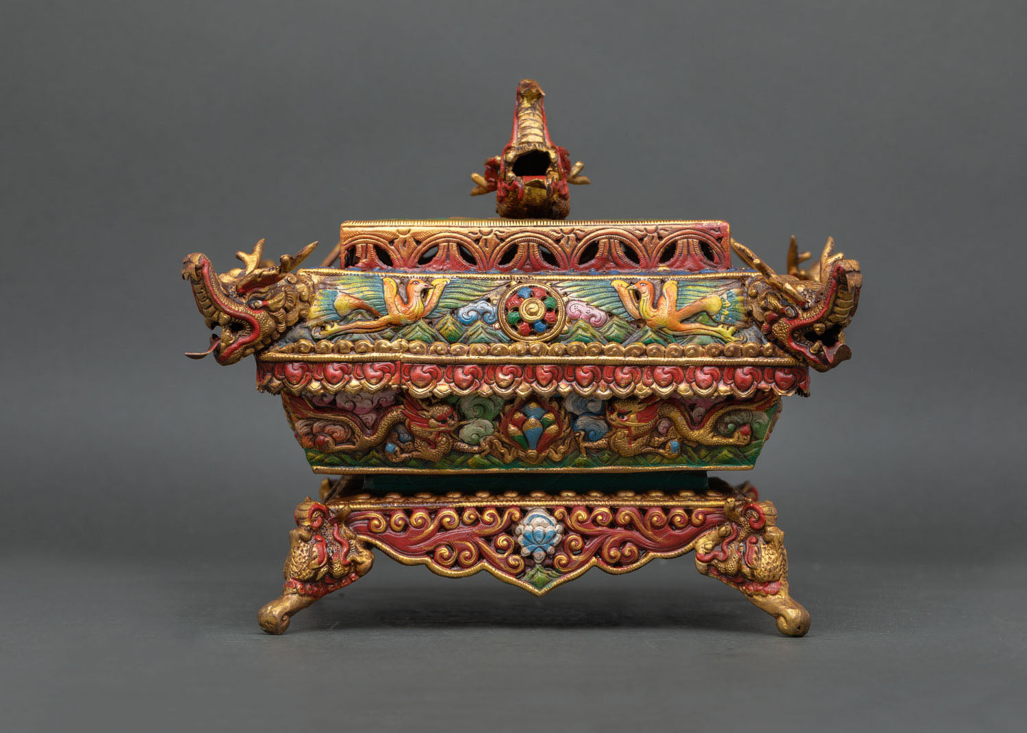 top view of incense burner lid featuring ornate dragon detailing and traditional tibetan ritual design