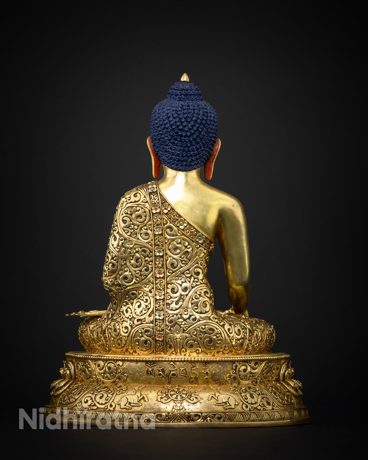 Traditional Nepalese Buddhist statue of Shakyamuni Buddha with luminous gold gilding for meditation spaces and home shrines.
