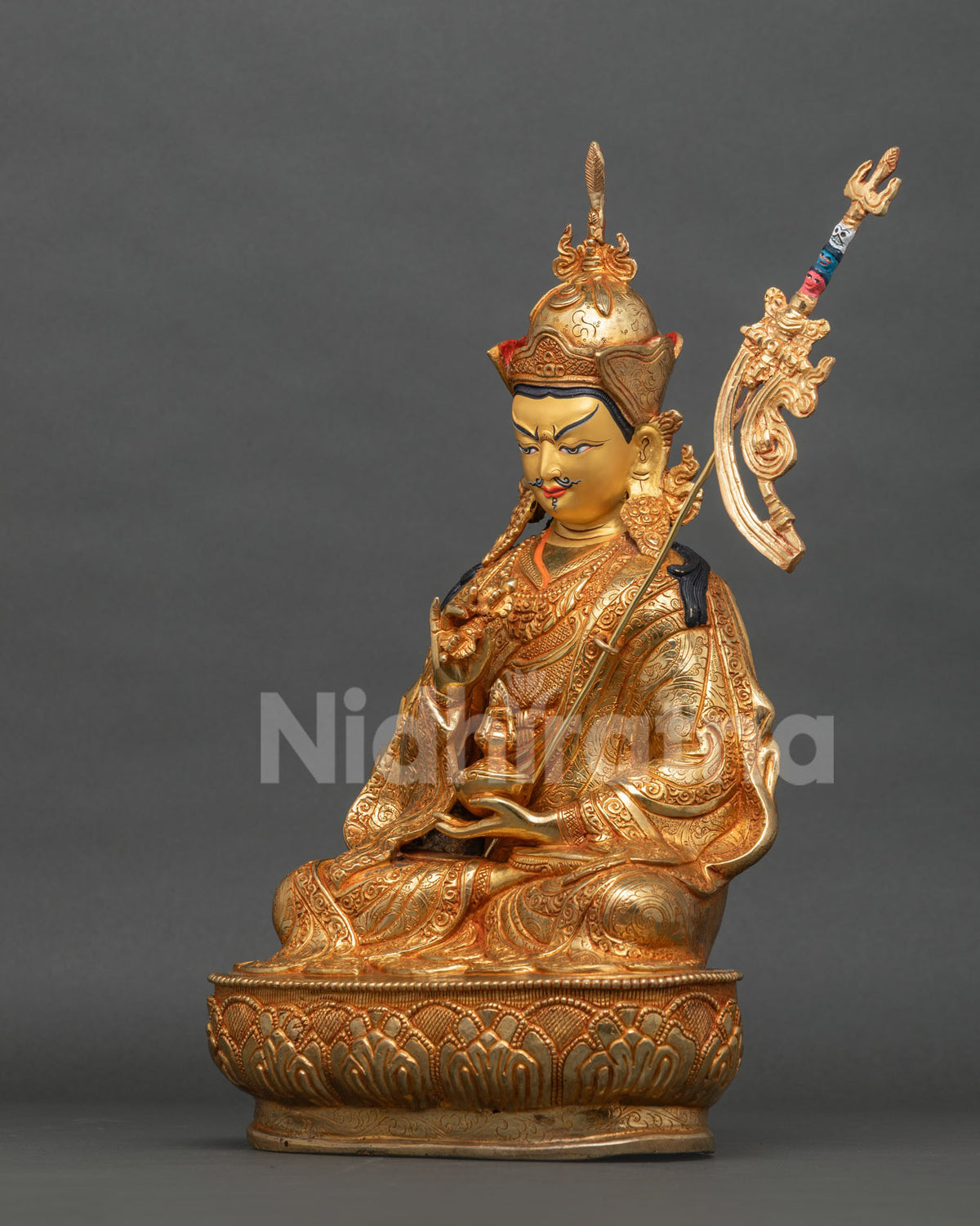 Tsokye Dorje statue opposite side view with hand-chased robes and lotus base