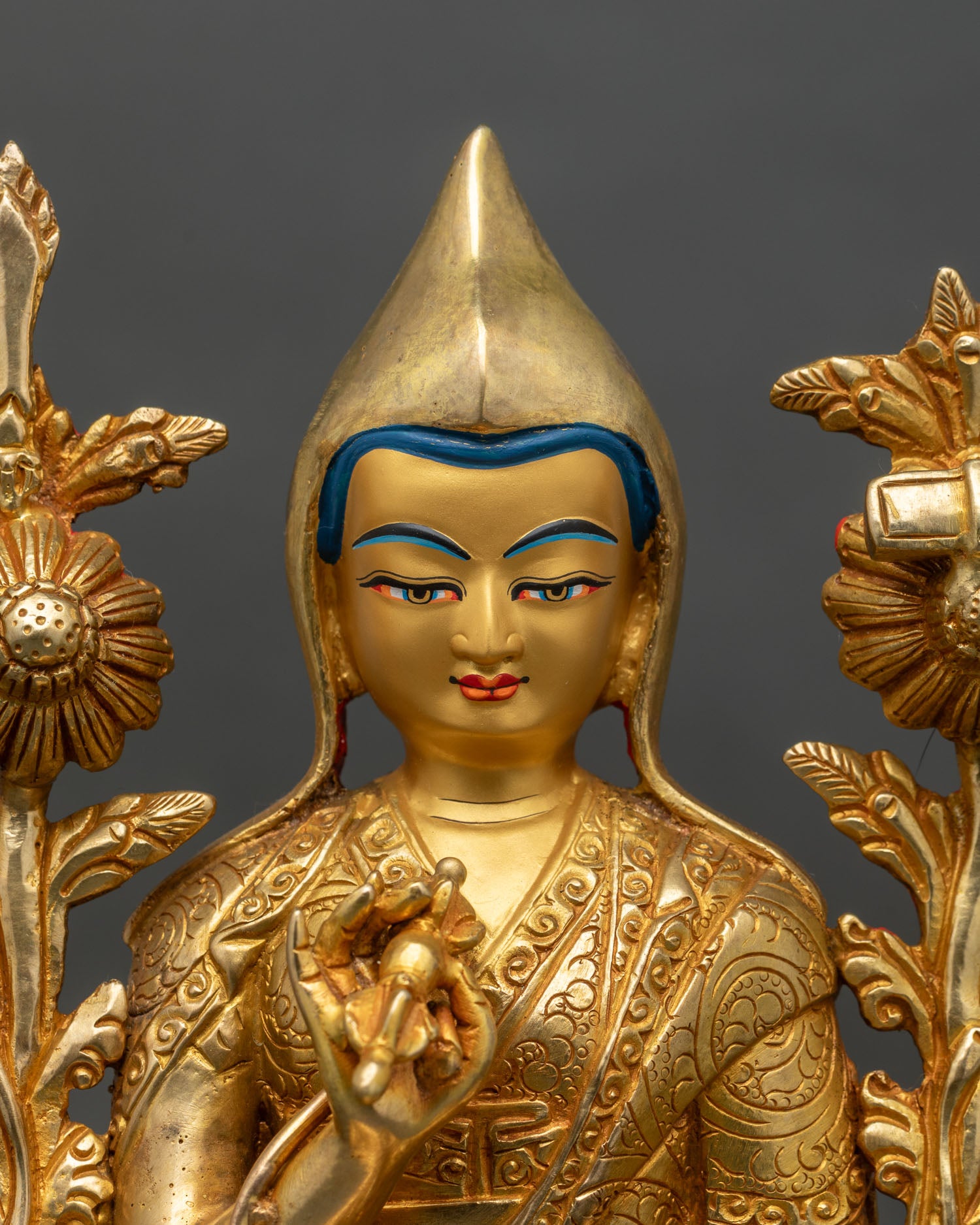 close-up of tsongkhapa statue showing lotus pedestal and detailed robes