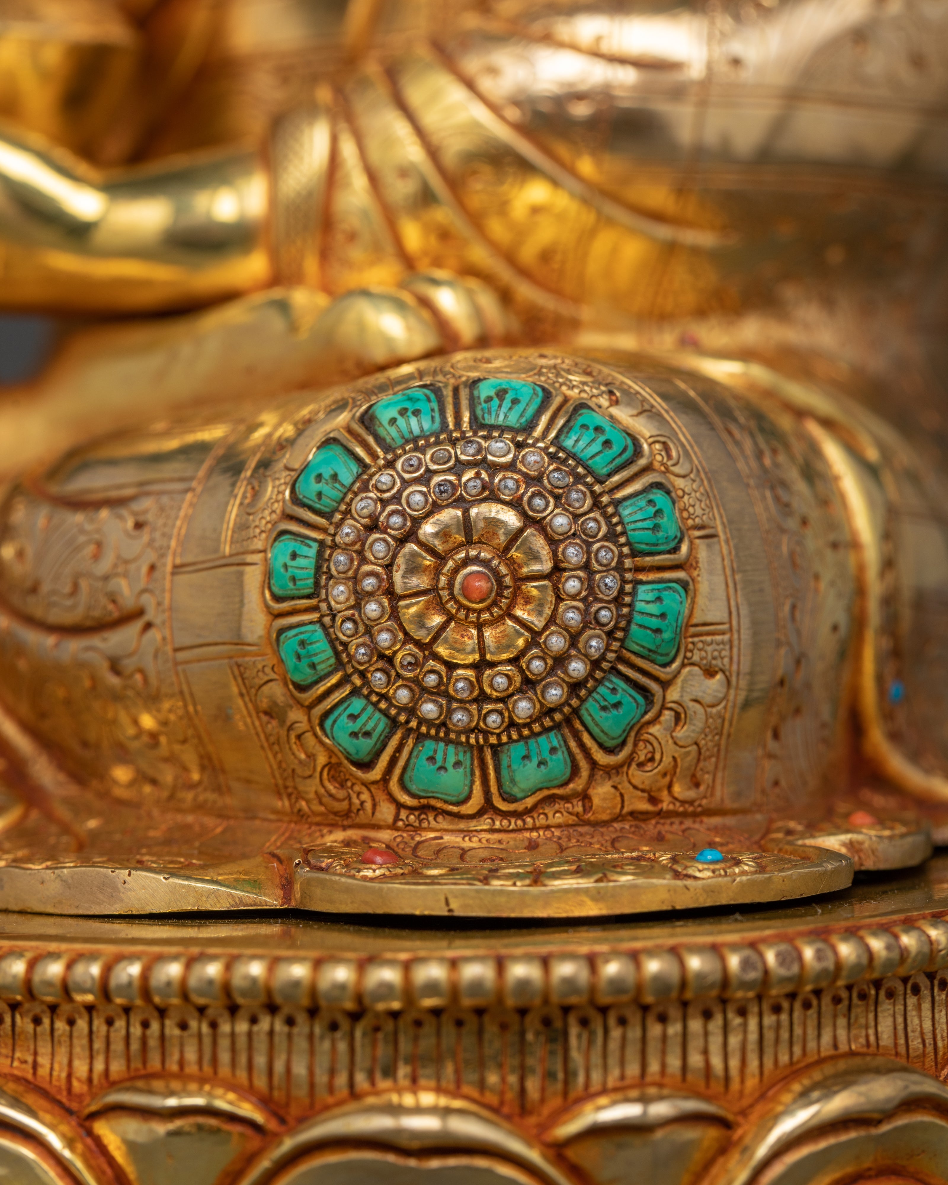 turquoise gemstones adorned in golden shakyamani buddha statue