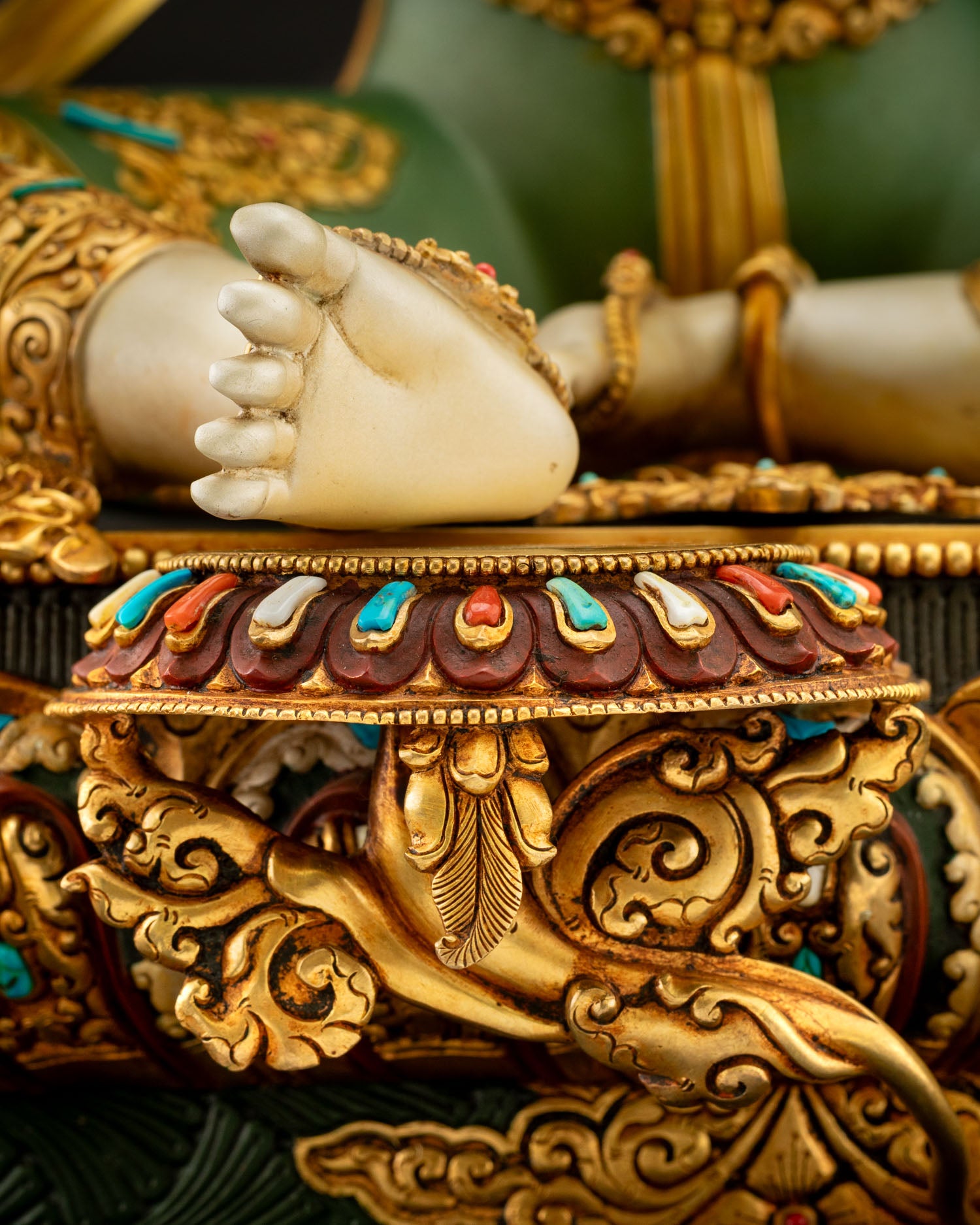 Two-Armed Chenrezig lower body Lalitasana posture detail with green acrylic painted robes