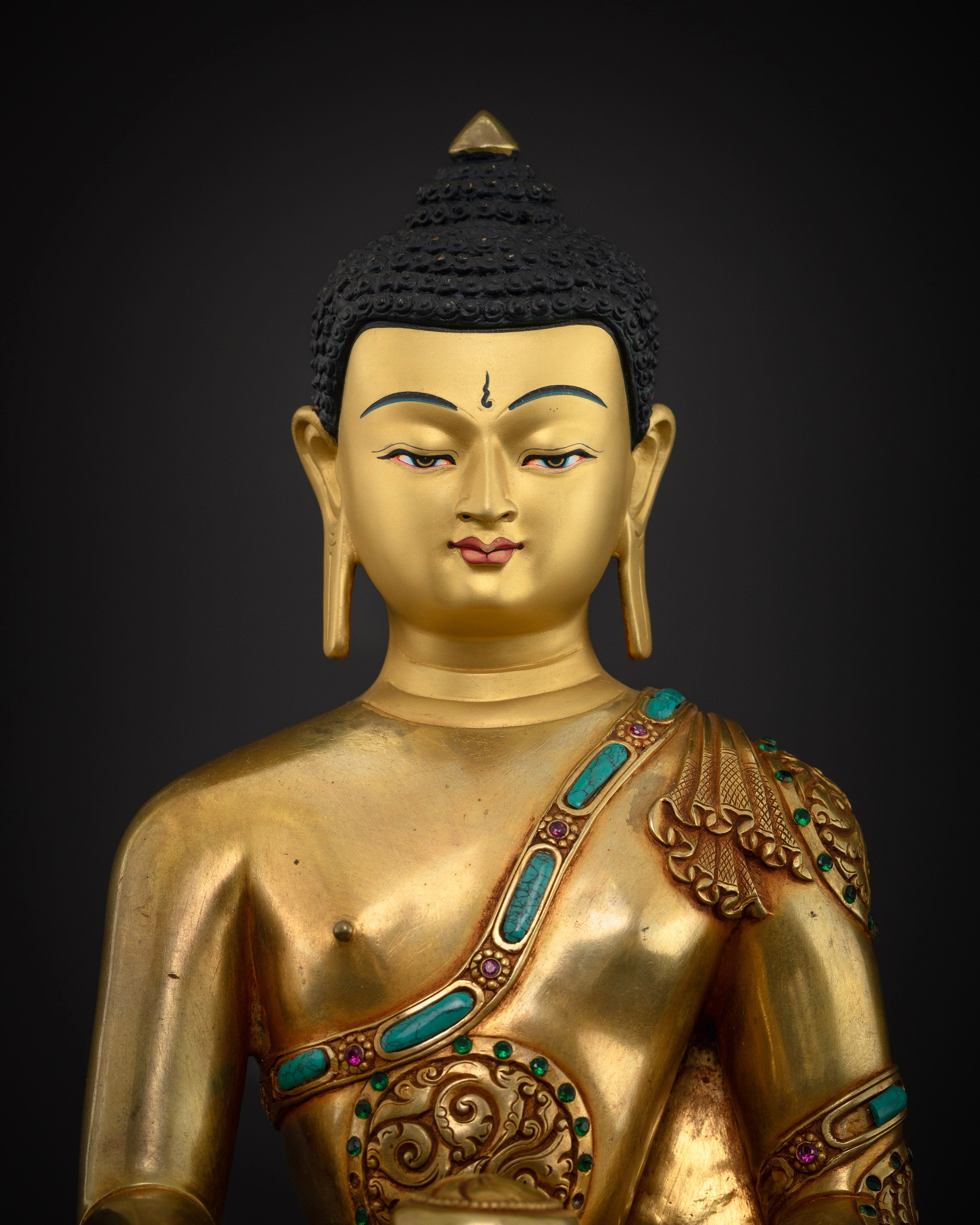 Close-Up of Shakyamuni Buddha Statue with Begging Bowl and Lotus Base