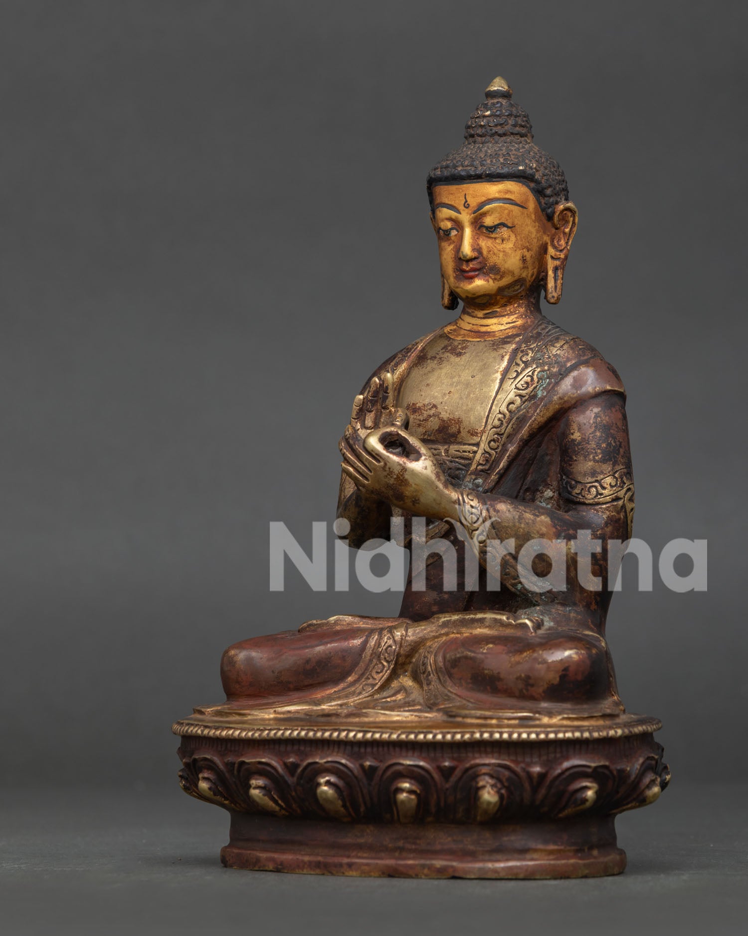 Vairocana Buddha Statue Detail Showing Handcarved Monk’s Robe and Dharmachakra Mudra.