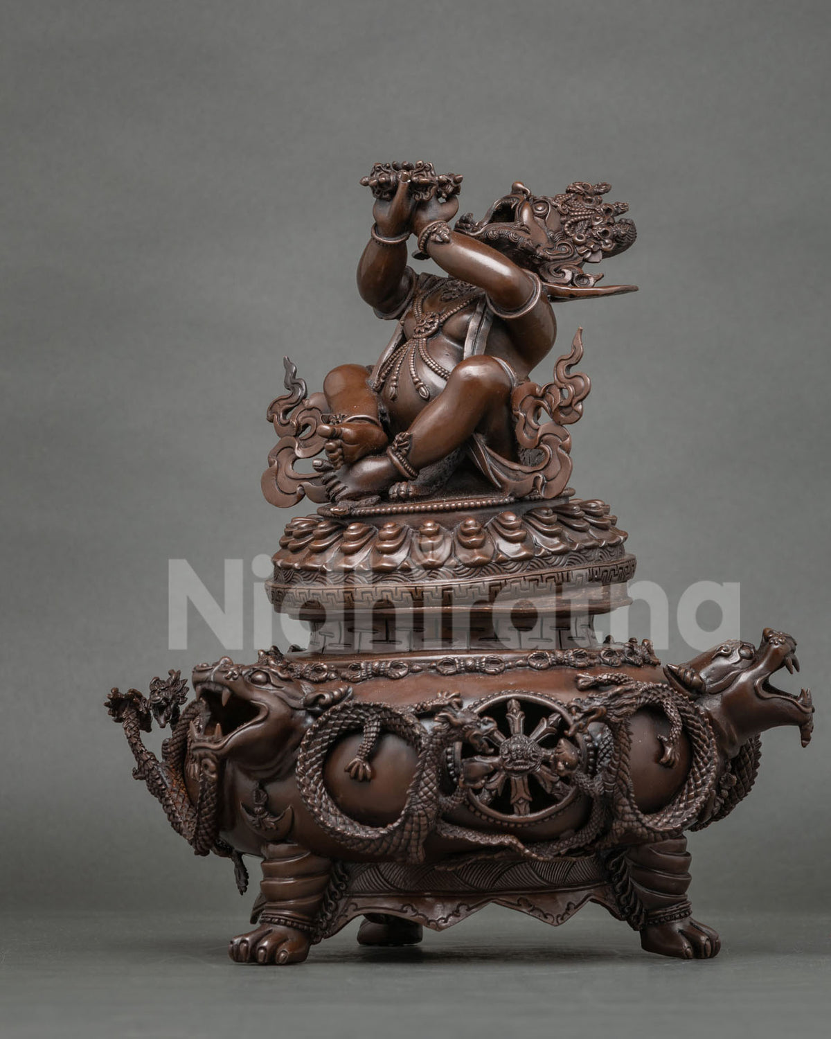 Vajradaka incense burner statue in side profile showing dharma wheel and dragons