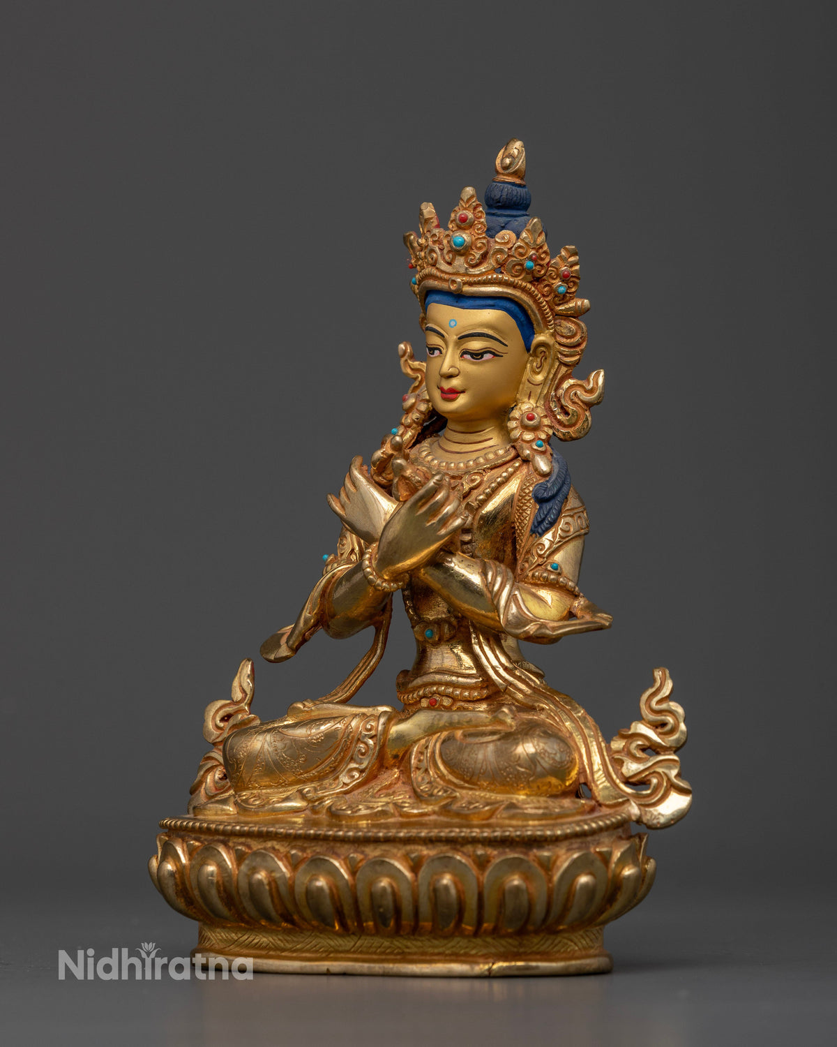Vajradhara Meditation Statue with radiant gold fire-gilding symbolizing wisdom and compassion in Vajrayana Buddhism