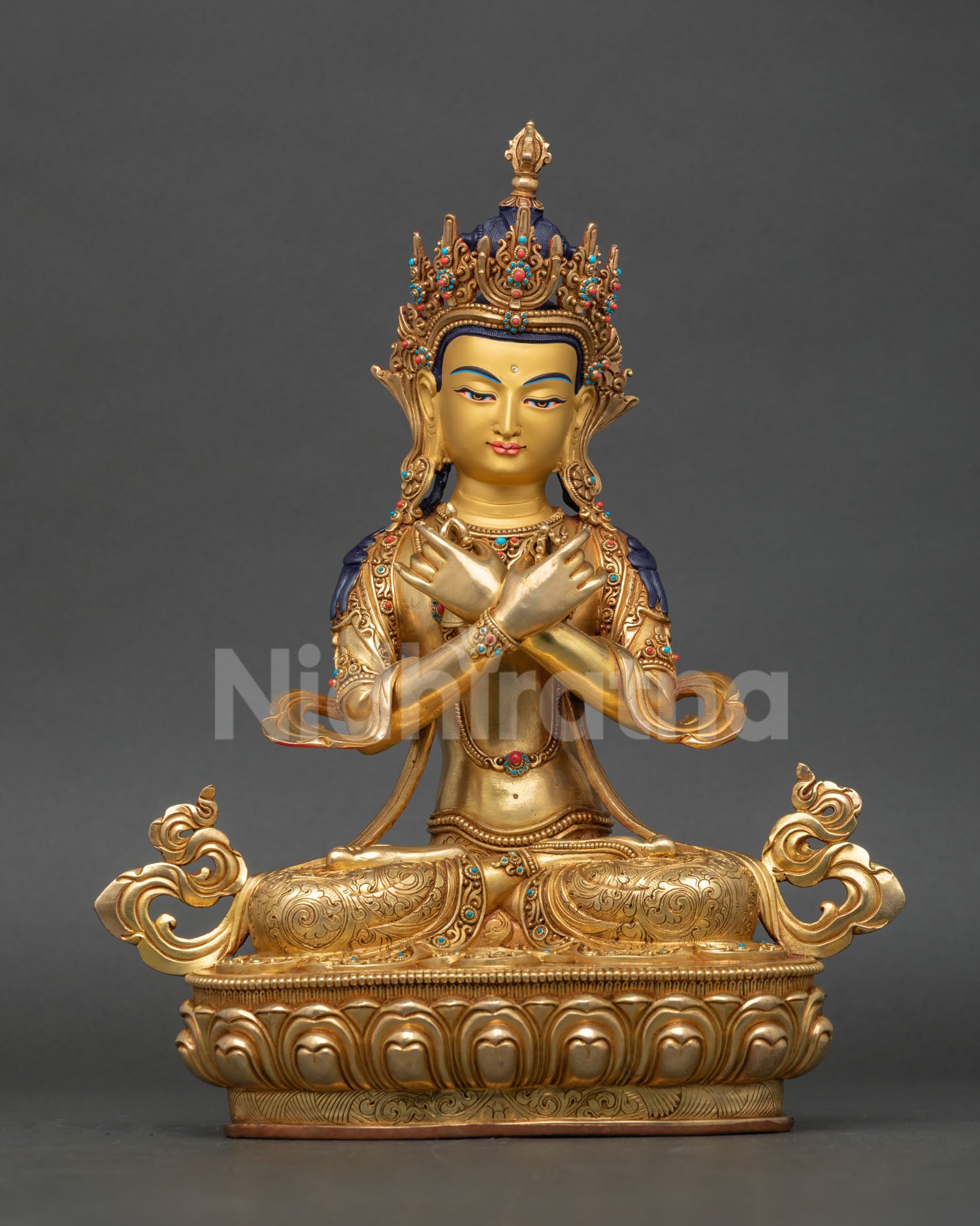Front view of Vajradhara Statue handcrafted in Nepal with copper, 24K gold gilding, and semiβprecious stone detailing