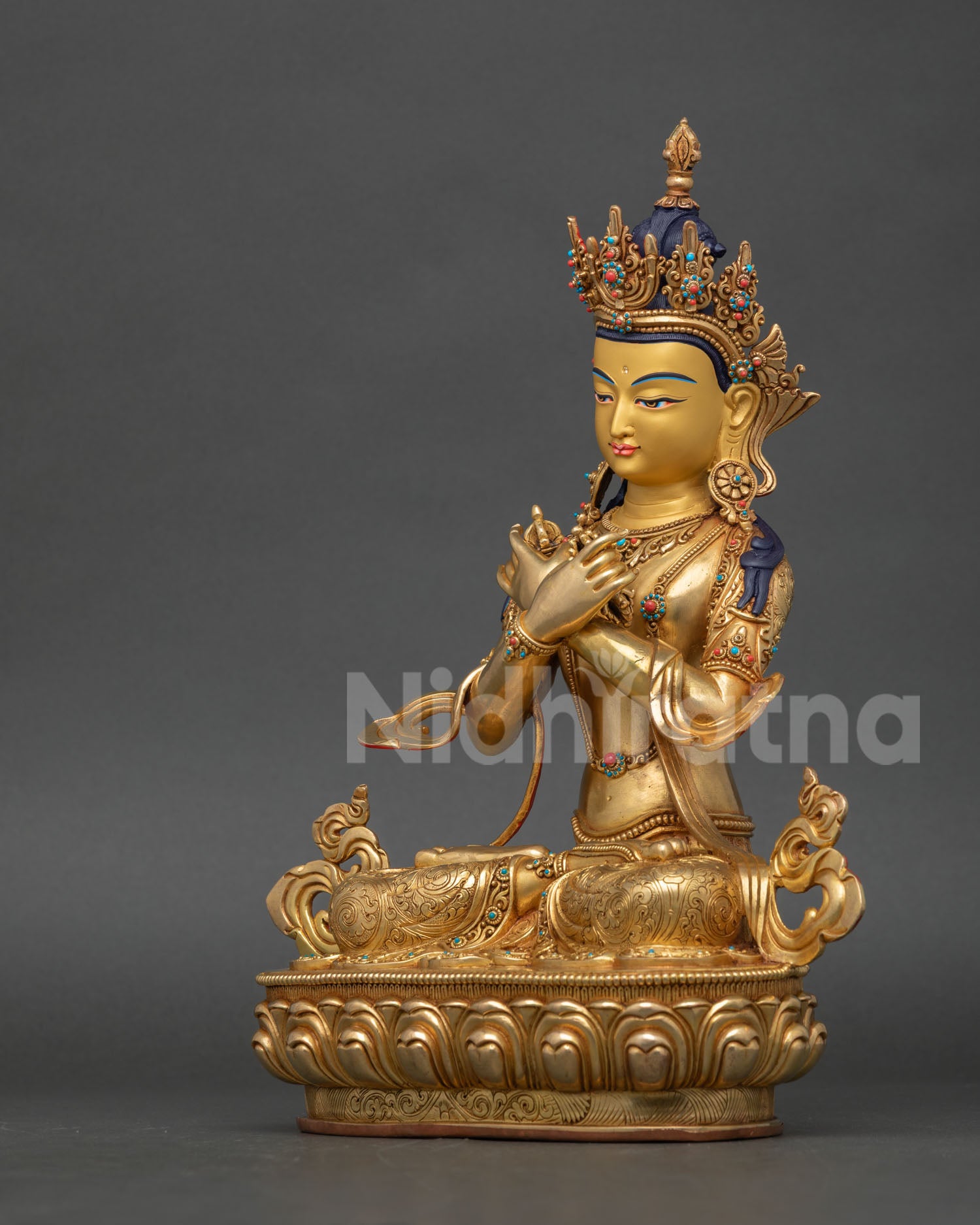 Left side view of Vajradhara Statue with repoussΓ©βstyle ornamentation and semiβprecious stone accents
