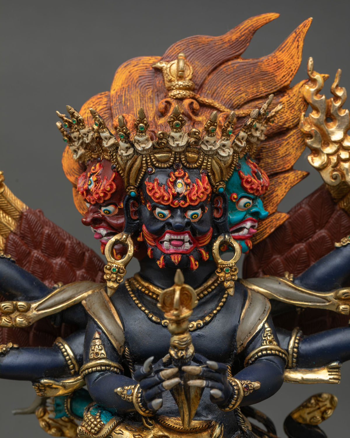 Vajrakilaya Statue close up three headed deity acrylic details semi precious stones.