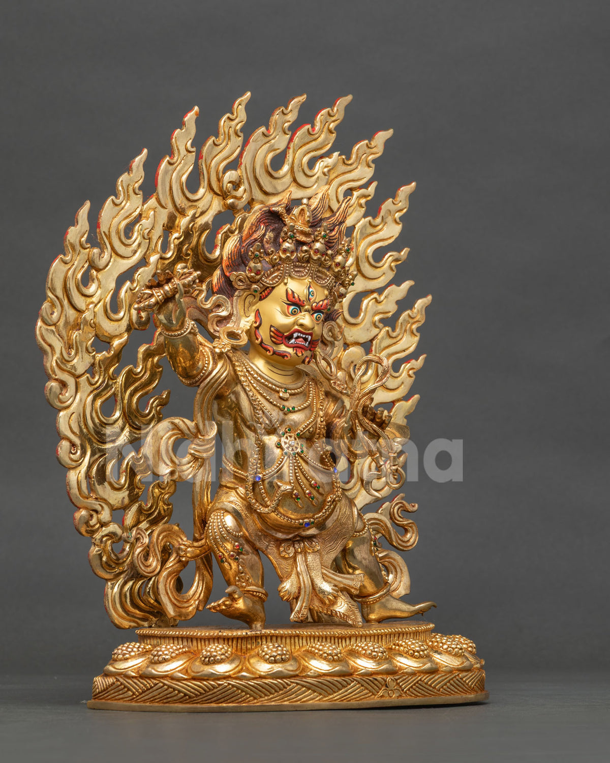 Vajrapani bodhisattva in wrathful posture holding vajra and lasso on lotus pedestal.