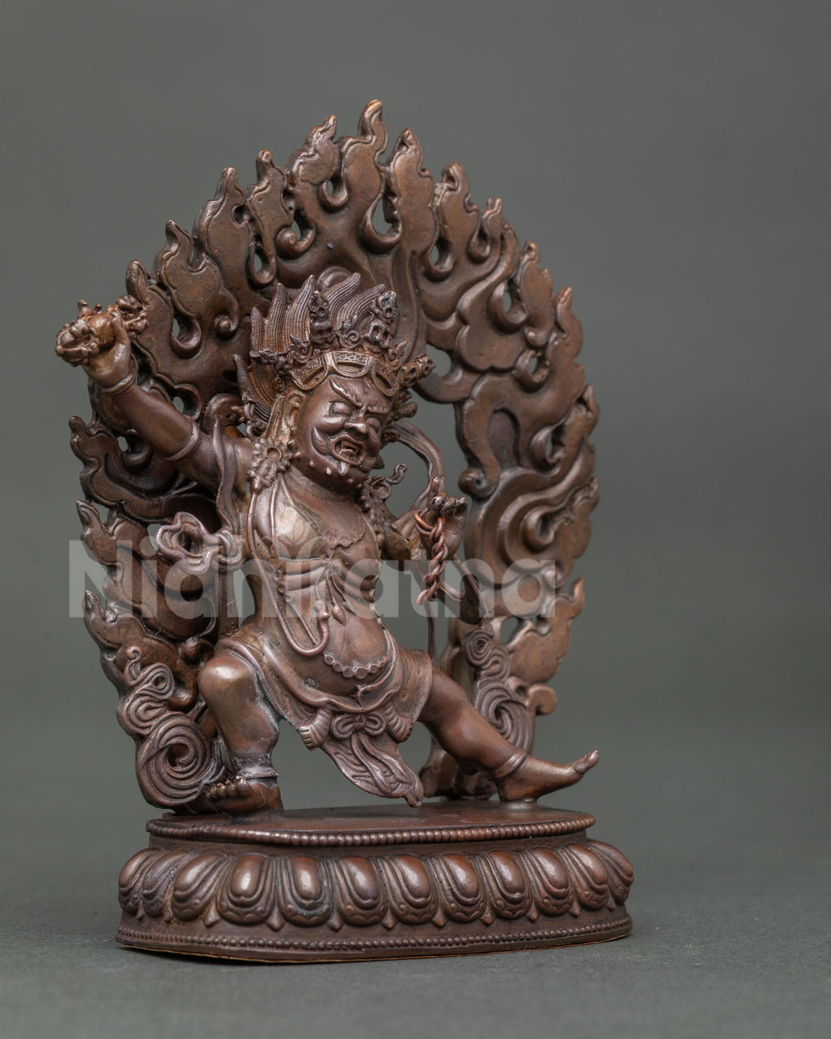 Vajrapani Buddhist Statue holding vajra and lasso surrounded by a flaming halo