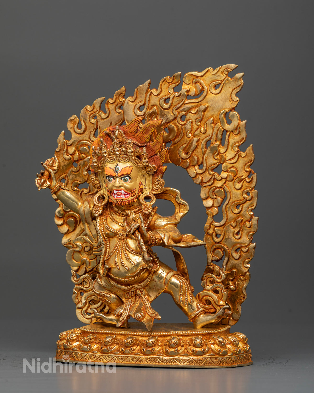 Vajrapani Chana Dorje statue with gold painted face and blazing halo