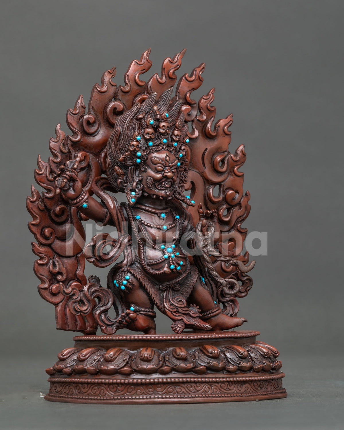 Vajrapani standing on handcarved lotus pedestal holding vajra and lasso.