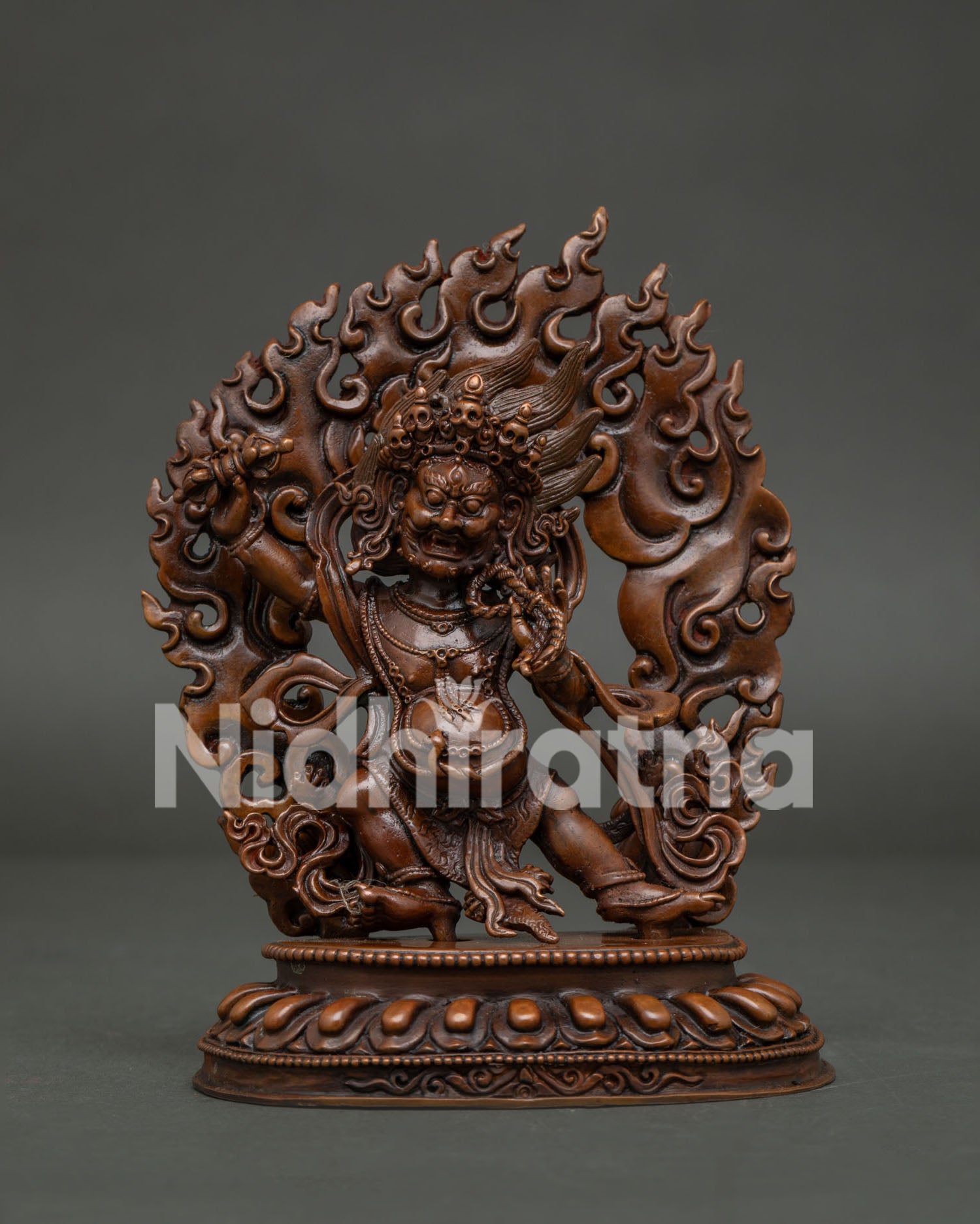 Vajrapani Statue from Nepal handcrafted in Patan with oxidized copper and flaming halo.