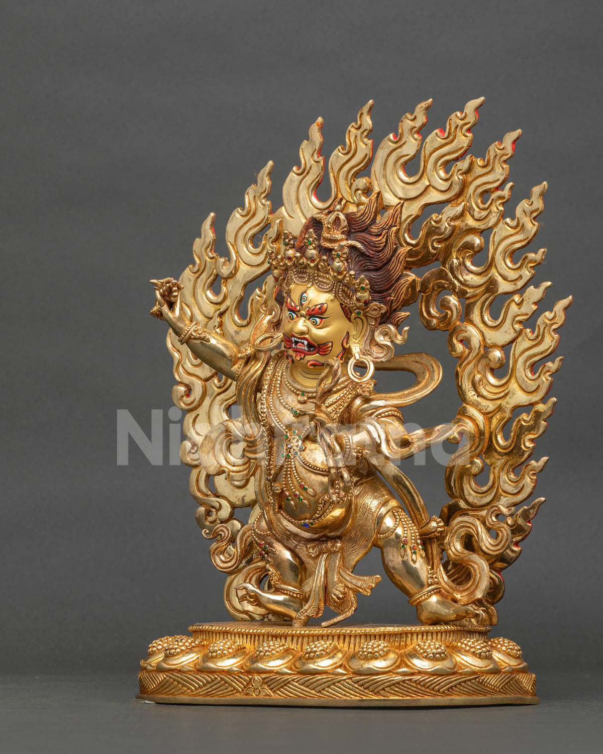 Vajrapani statue with 24k gold painted face and semi precious stone adornments.