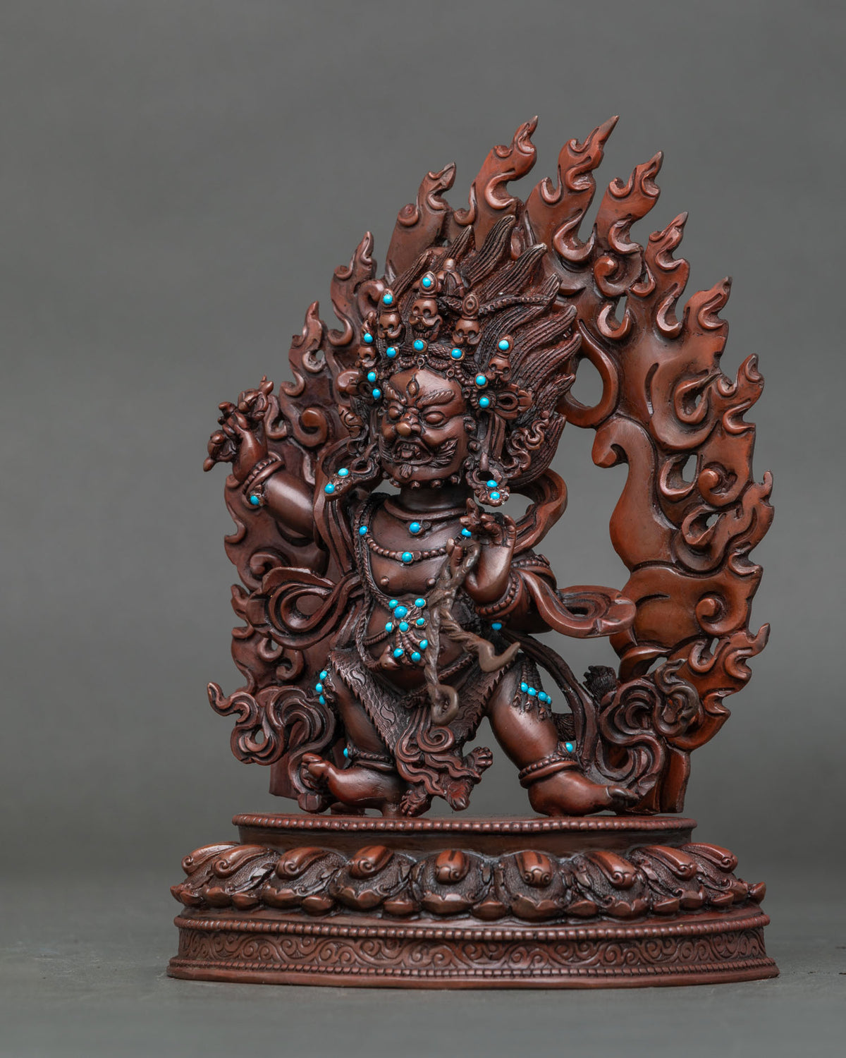 Vajrapani statue with skull crown tiger skin garment and semi precious stones.