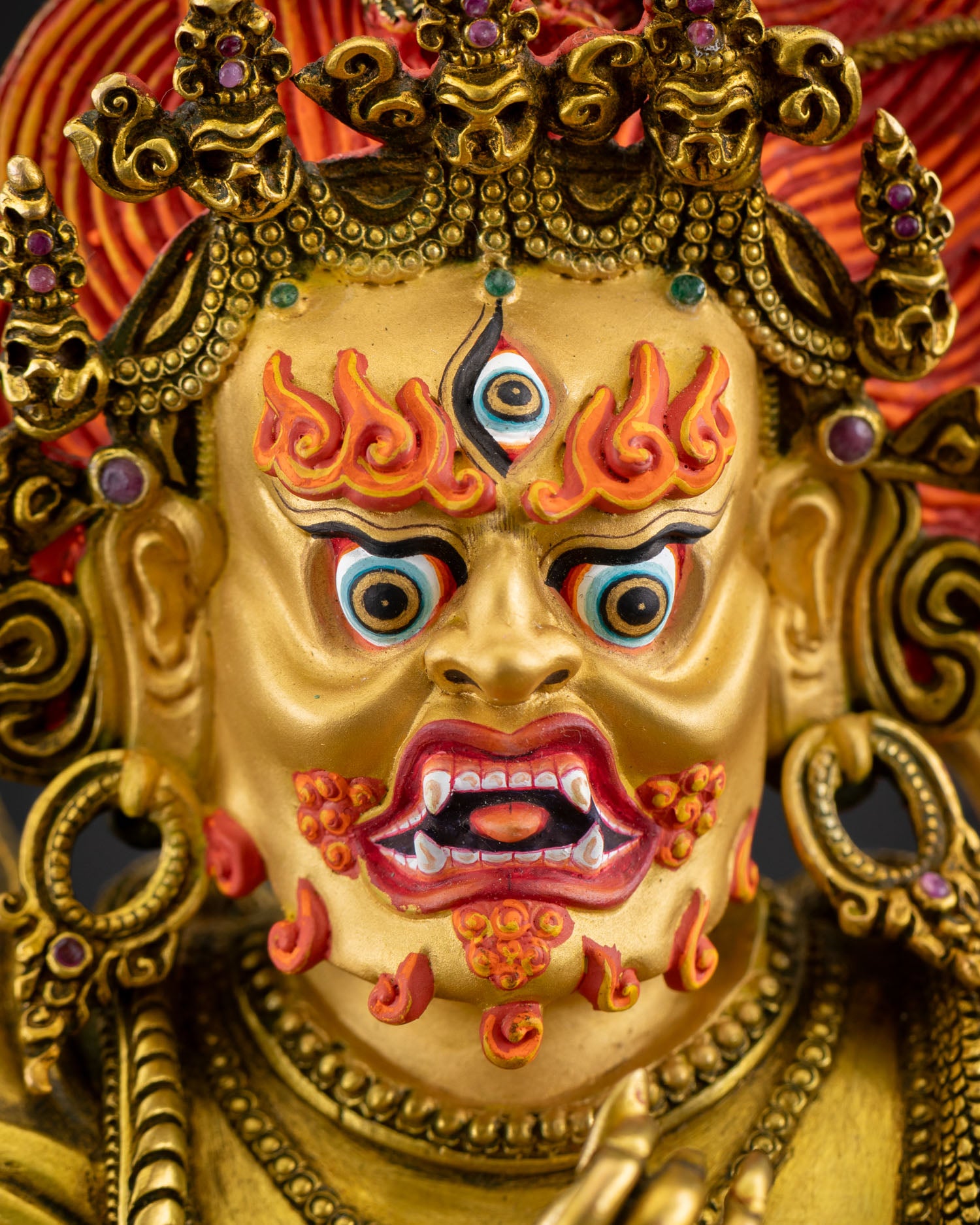 Vajrapani wrathful face gold painted features third eye fierce protector deity copper sculpture Tibetan Buddhist guardian sacred altar artwork