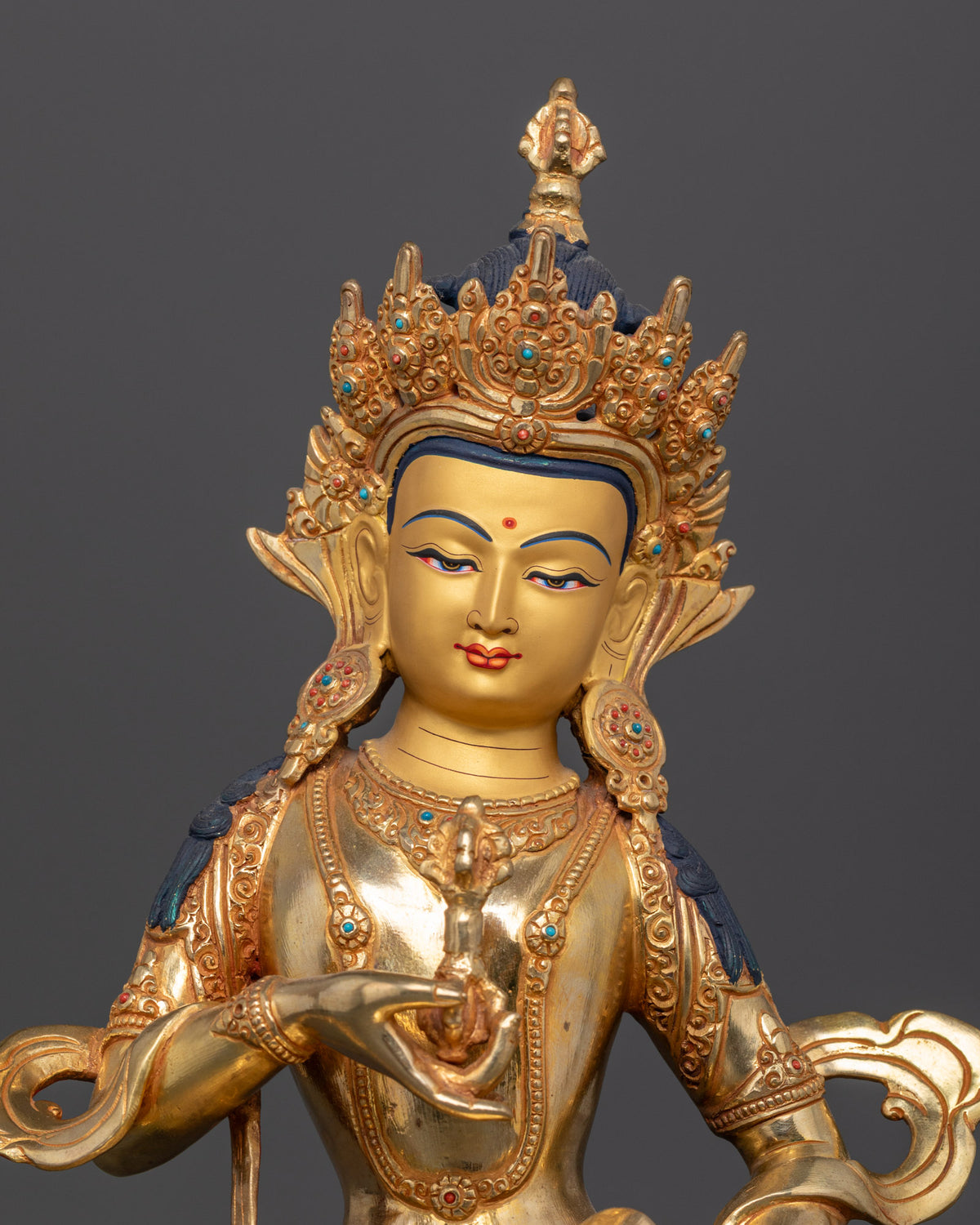 Vajrasattva Buddhist statue holding vajra and bell symbolizing wisdom and skillful means