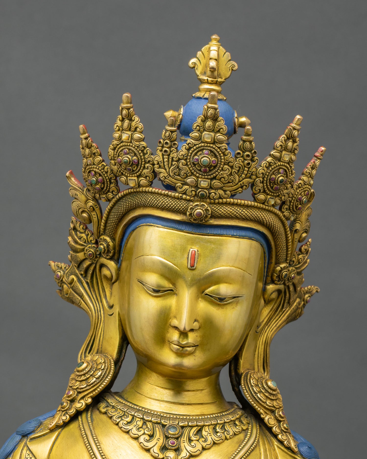 Detailed face close-up of Vajrasattva Dorje Sempa statue with serene expression and jeweled crown