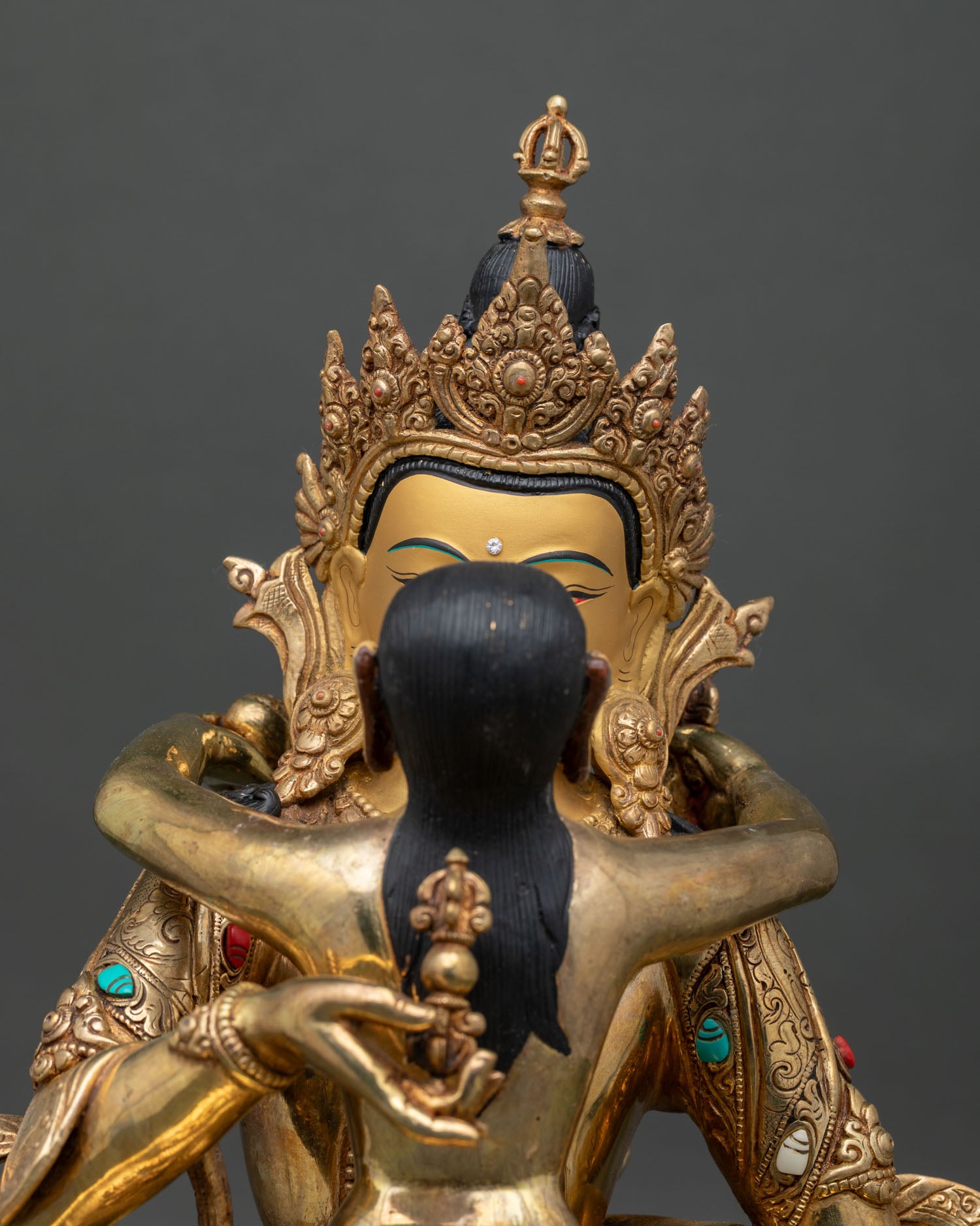 vajrasattva face close-up with gold-painted features and intricate newari craftsmanship
