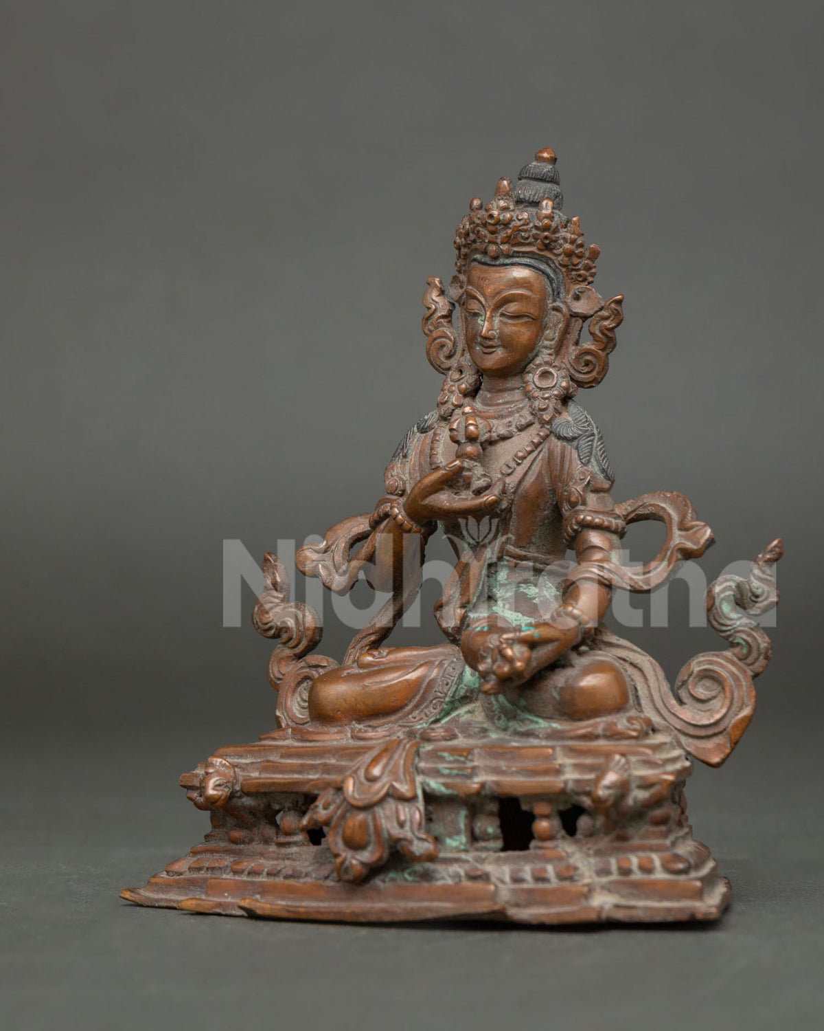 Vajrasattva statue finely chased ornaments and layered necklaces detail view.