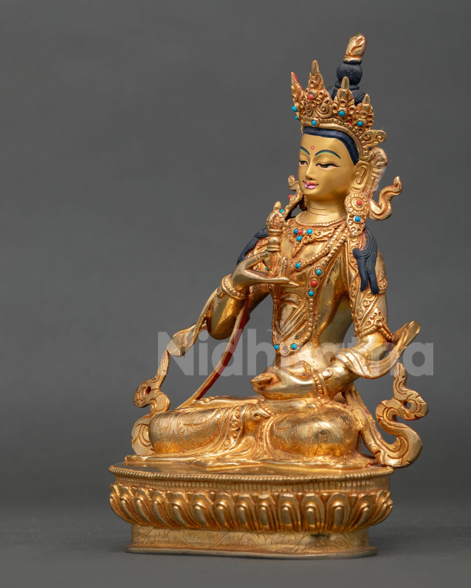Vajrasattva statue left side view, detailed Newari craftsmanship, gold gilded spiritual figure