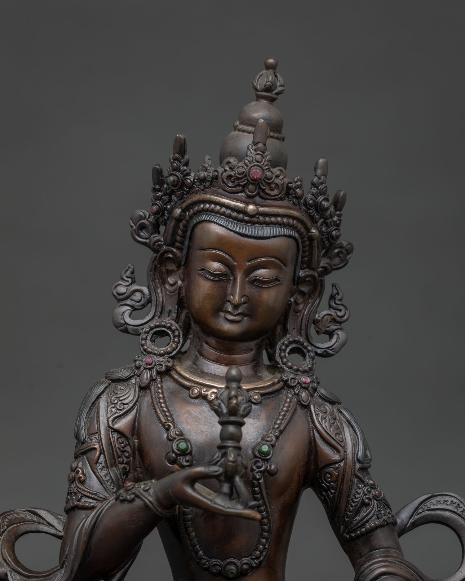 Vajrasattva statue with semi-precious gemstones jeweled crown and ornaments.