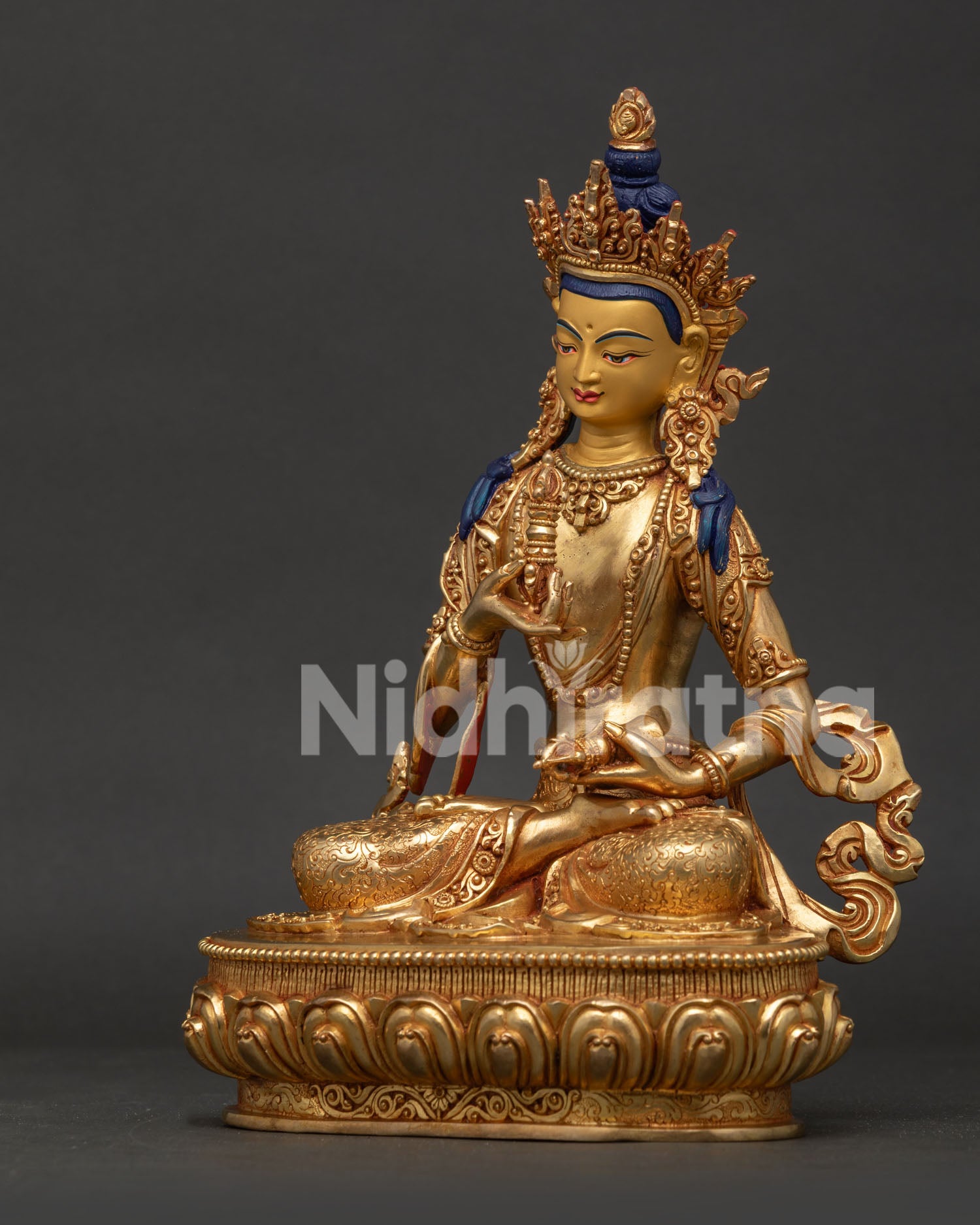 Vajrasattva with intricate crown ornaments and detailed Buddhist craftsmanship.