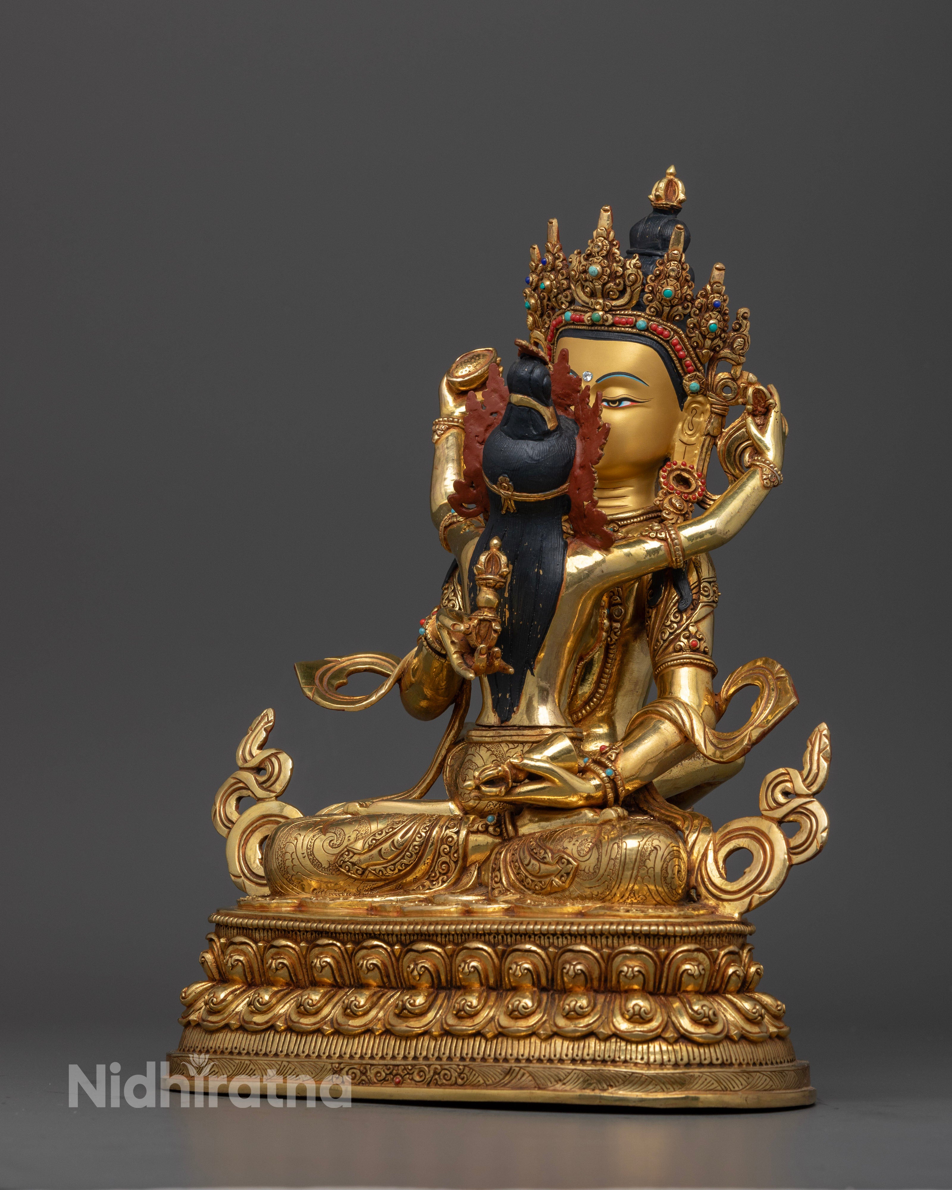 side view of vajrasattva statue with consort in yab yum form