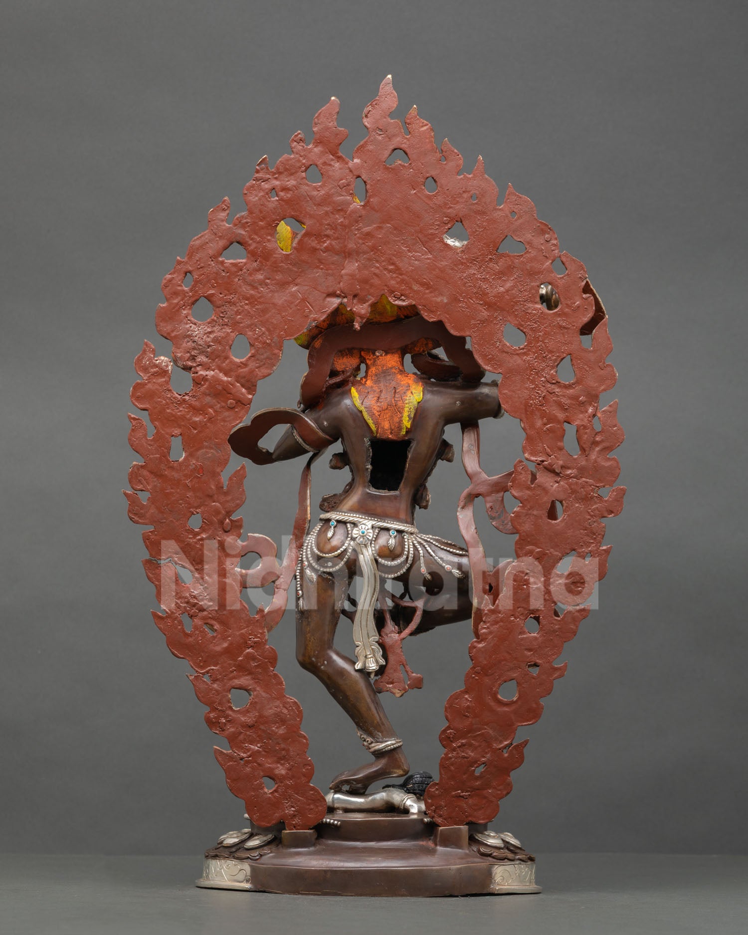 Vajravarahi Dorje Phagmo statue back view silver plated copper sculpture flaming halo Nepalese Vajrayana Buddhist art