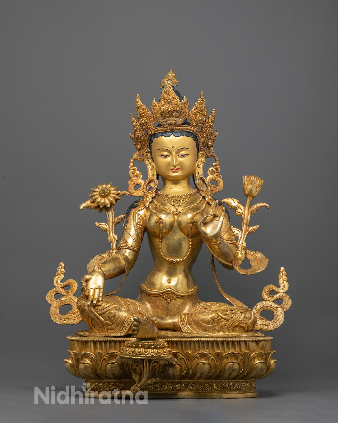 Front view of Green Tara Statue seated on lotus base in varada mudra