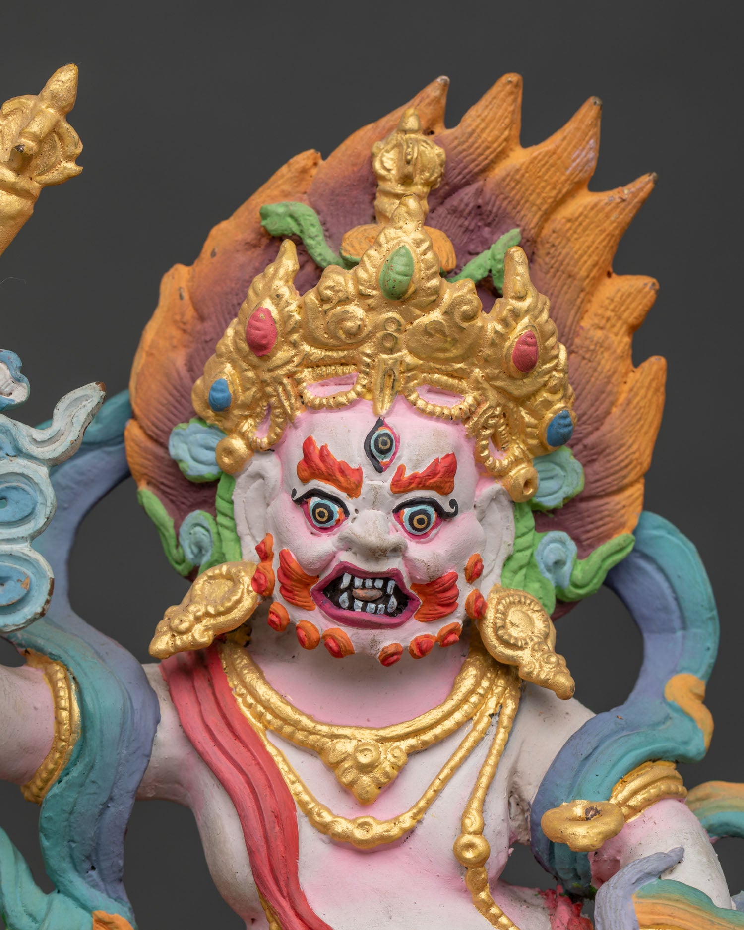 White Dzambhala Statue Holding Staff Ritual Scepter and Mongoose Close Up.