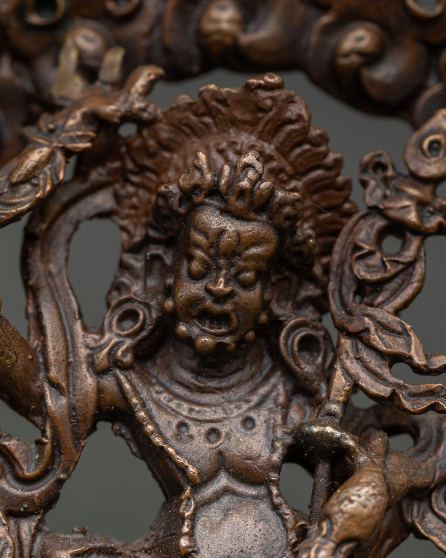White Dzambhala statue holding staff ritual scepter and mongoose.